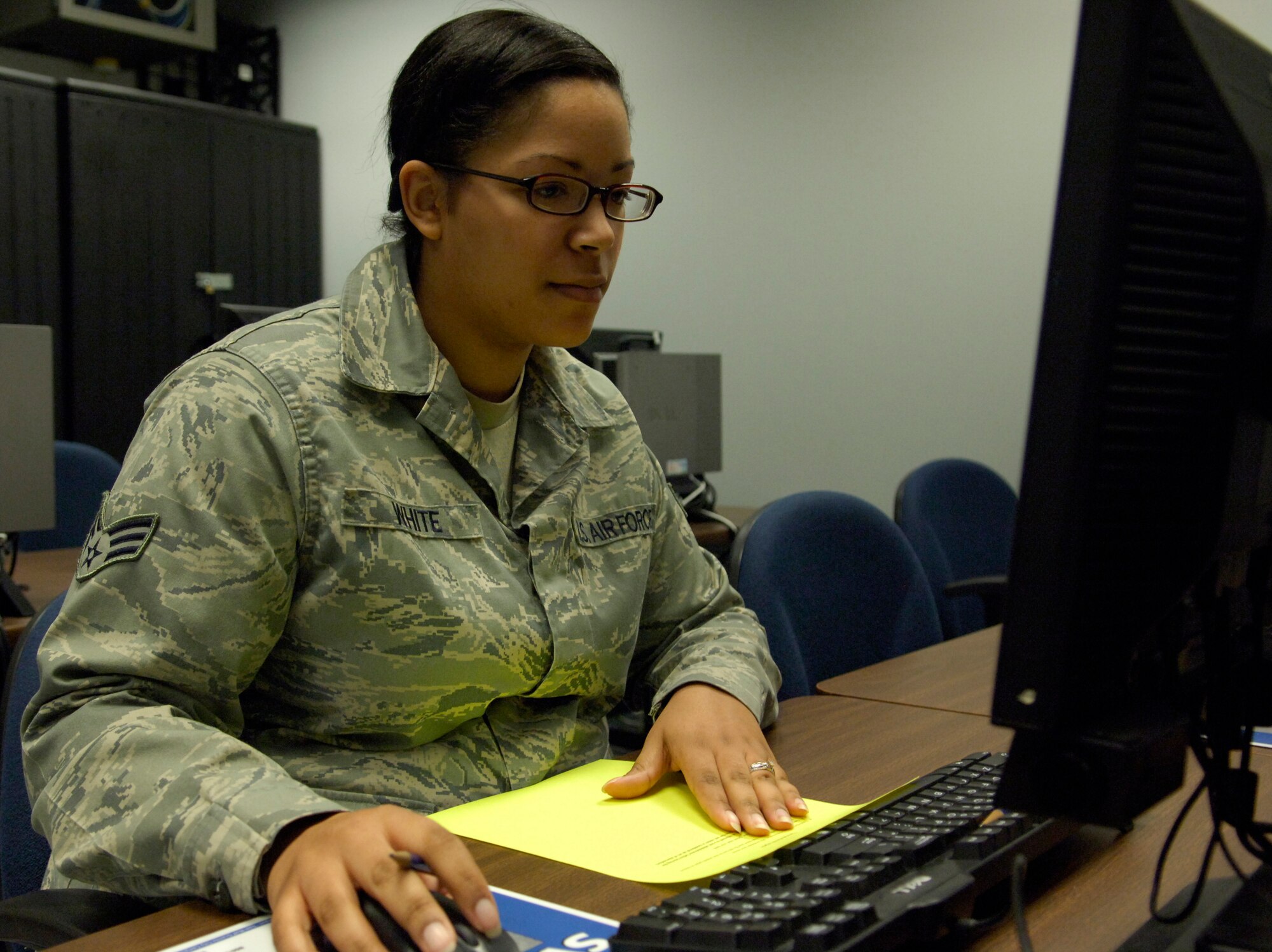 Senior Airman Moriah White, 375th Comptroller Squadron customer service technician, takes a College Level Examination Program test recently. White is working toward her Community College of the Air Force degree. (U.S. Air Force photo by Senior Airman Amber R. Kelly-Herard) 