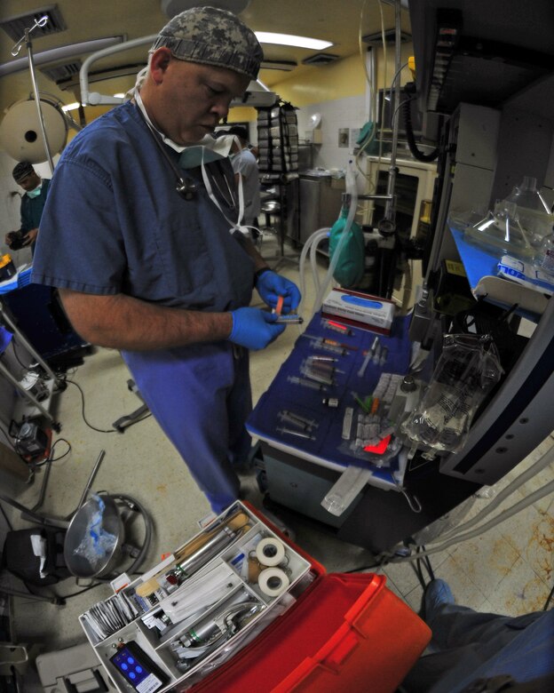 SOTO CANO AB, Honduras -- Army Maj. James Eads, Mobile Surgical Team nurse anesthetist, preps anesthesia medication prior to an operation by the MST from Joint Task Force-Bravo, Soto Cano AB March 15 at the Santa Teresa Hospital in Comayagua, Honduras. JTF-Bravo is committed to partnering with countries through Central America for training and missions to support security, stability and prosperity throughout the region. (U.S. Air Force photo/Staff Sgt. Bryan Franks) 