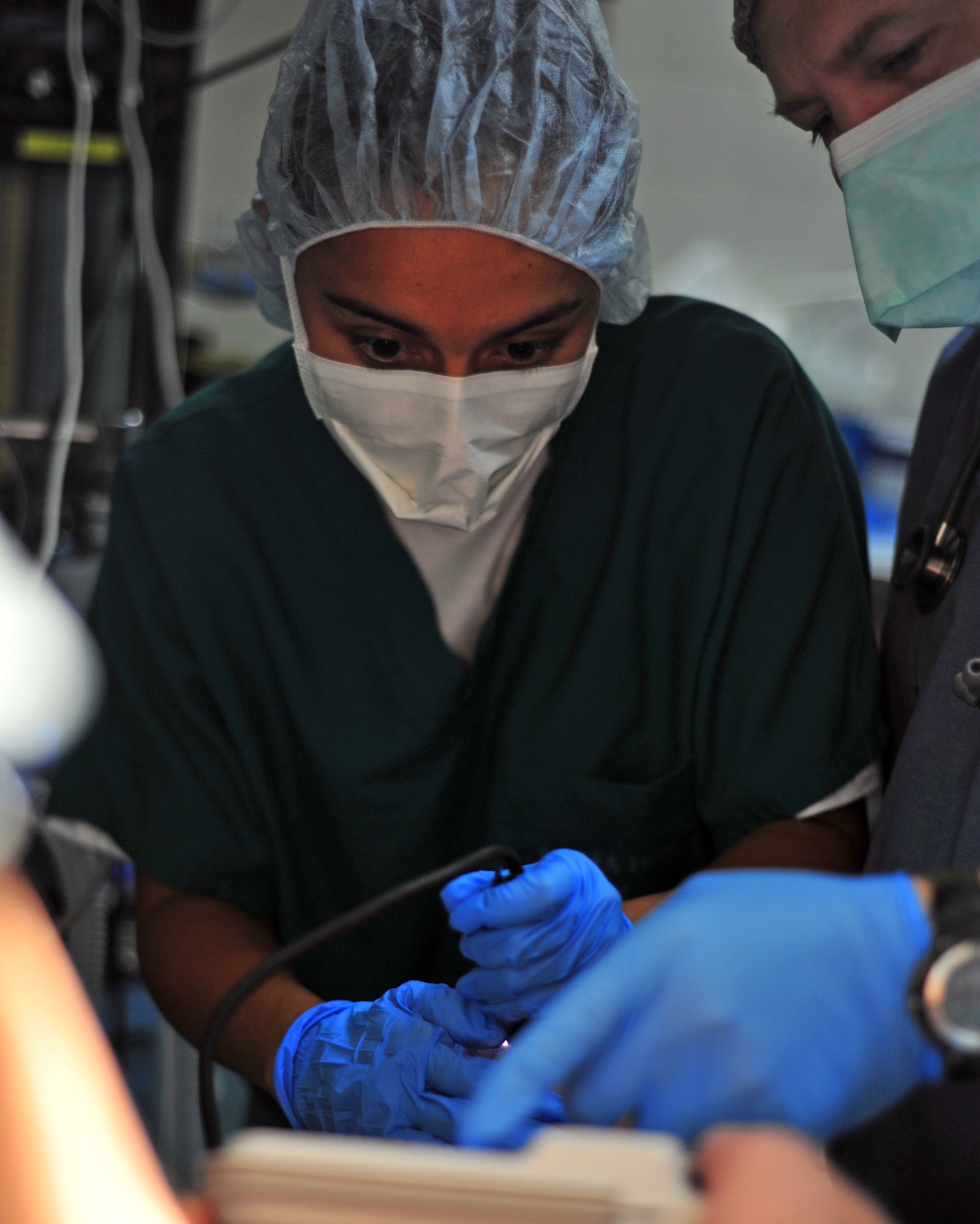 SOTO CANO AB, Honduras -- Air Force 1st Arlene Parada, Medical Element nurse, intubates a Honduran male prior to his operation by the Mobile Surgical Team from Joint Task Force-Bravo, Soto Cano AB March 15 at the Santa Teresa Hospital in Comayagua, Honduras. Providing quality medical care is the MST main objective as well as building relationships, to improve future mission success. (U.S. Air Force photo/Staff Sgt. Bryan Franks) 