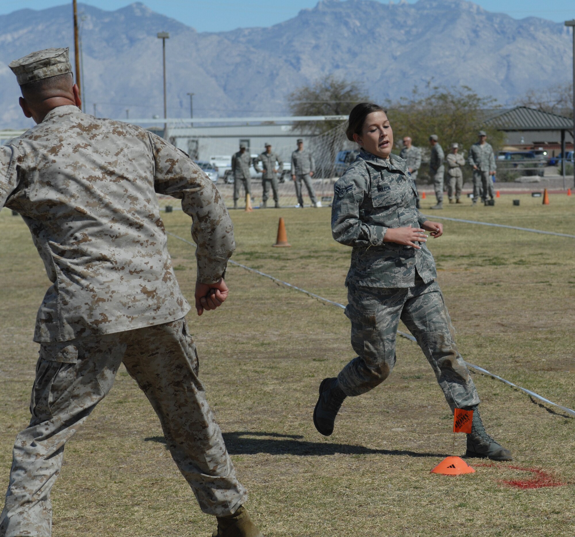 U.S. Air Force Airman 1st Class Timotea DeLeon, 355th Communications Squadron, runs the zigzag portion of the Marine Challenge at the Benko Fitness Center track on Davis-Monthan Air Force Base, Ariz., March. 23. Participants in the challenge completed activities such as the low crawl and a grenade throw. (U.S. Air Force photo by Airman 1st Class Saphfire Cook/Released)