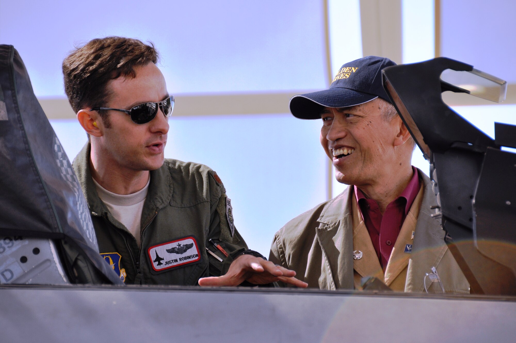 Maj. Justin Robinson, 308th Fighter Squadron, explains the instruments inside an F-16 Falcon to former U.S. Ambassador and 433rd Airlift Wing honorary commander Sichan Siv during the 433rd Airlift Wing's recent civic leader tour to Luke and Davis Monthan Air Force Bases in Arizona. Amabassador Siv was one of 17 San Antonio civic leaders to take the tour.  Civic leaders also flew in an F-16 simulator, met with other local civic leaders from the Phoenix and Tucson areas, visited the 305th Rescue Squadron pararescuemen and toured the Aerospace Maintenance and Regeneration Group, also known as "The Boneyard".  (U.S. Air Force Photo/ Tech. Sgt. Carlos Trevino)