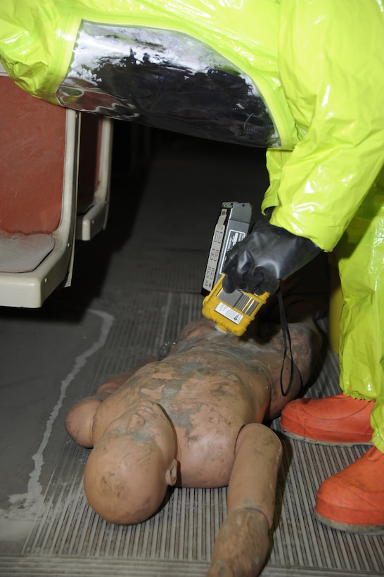 The Air Force District of Washington Black Flag Exercise at the Center for National Response in Gallagher W.Va. March 19-30 gave 1st Lt. Gregory Lathbury, 779th Aeromedical Squadron Occupational and Environmental Protection chief, an opportunity to monitor a simulated victim for any signs of radiation during training. The Joint Chemical Agent Detector equipment used detects alpha, beta and gamma radiation and intensity levels. (U.S. Air Force photo by Staff Sgt. Christopher Ruano)