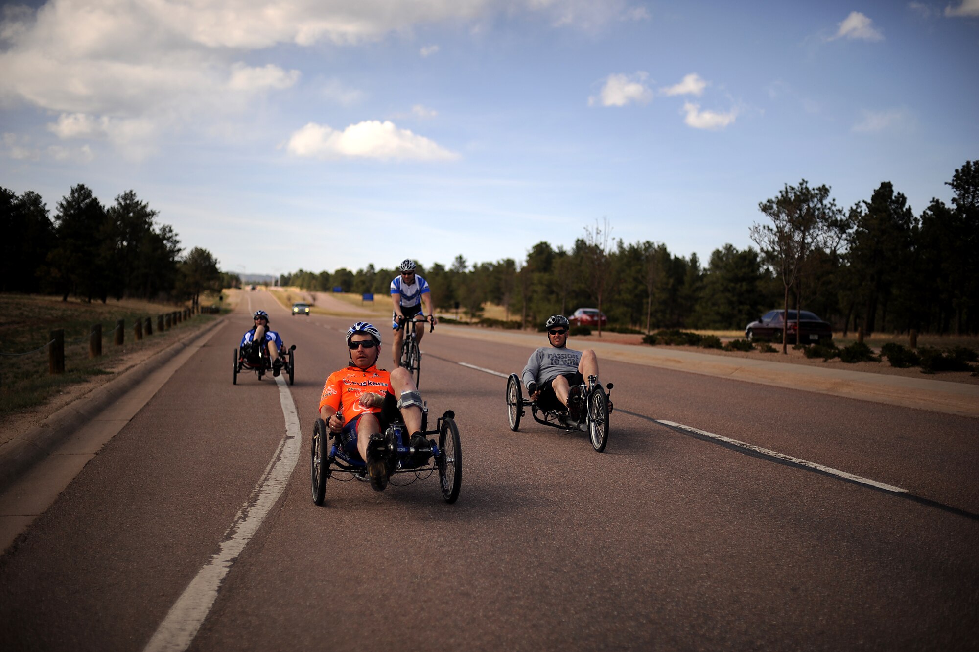 Capt. Anthony Simone (front) and Ramina Oraha, a retired senior airman (back left) train with their coaches on their cycles March 29, 2012, while at the Air Force Academy, Colo., during the Air Force Wounded Warrior Games selection camp. (U.S. Air Force photo/Master Sgt. Jeremy Lock) 