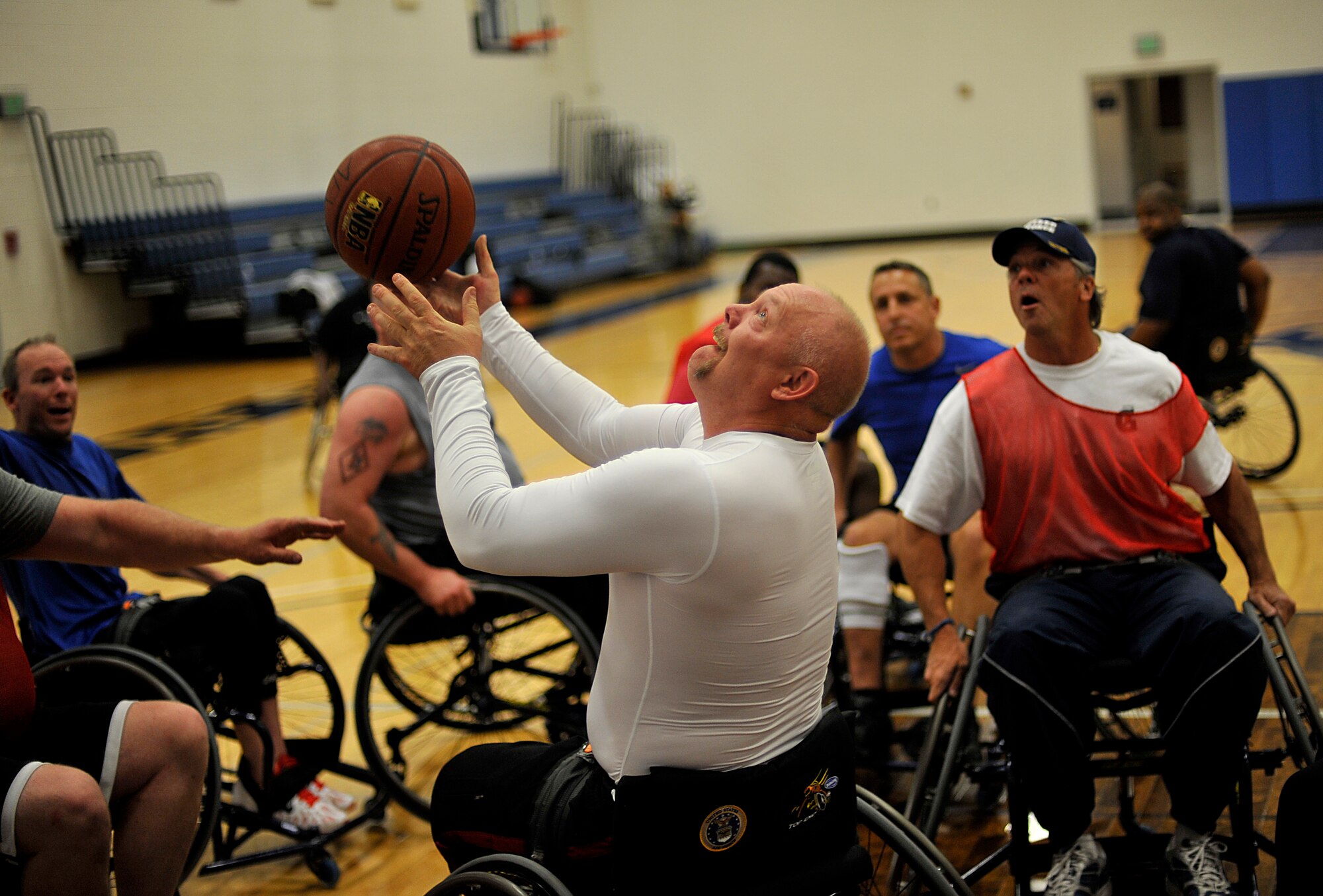 Timothy Wymore, a retired Air Force technical sergeant, shoots a basketball March 26, 2012, while playing wheelchair basketball at the Air Force Academy, Colo., during the Air Force Wounded Warrior Games selection camp. (U.S. Air Force photo/Master Sgt. Jeremy Lock) 