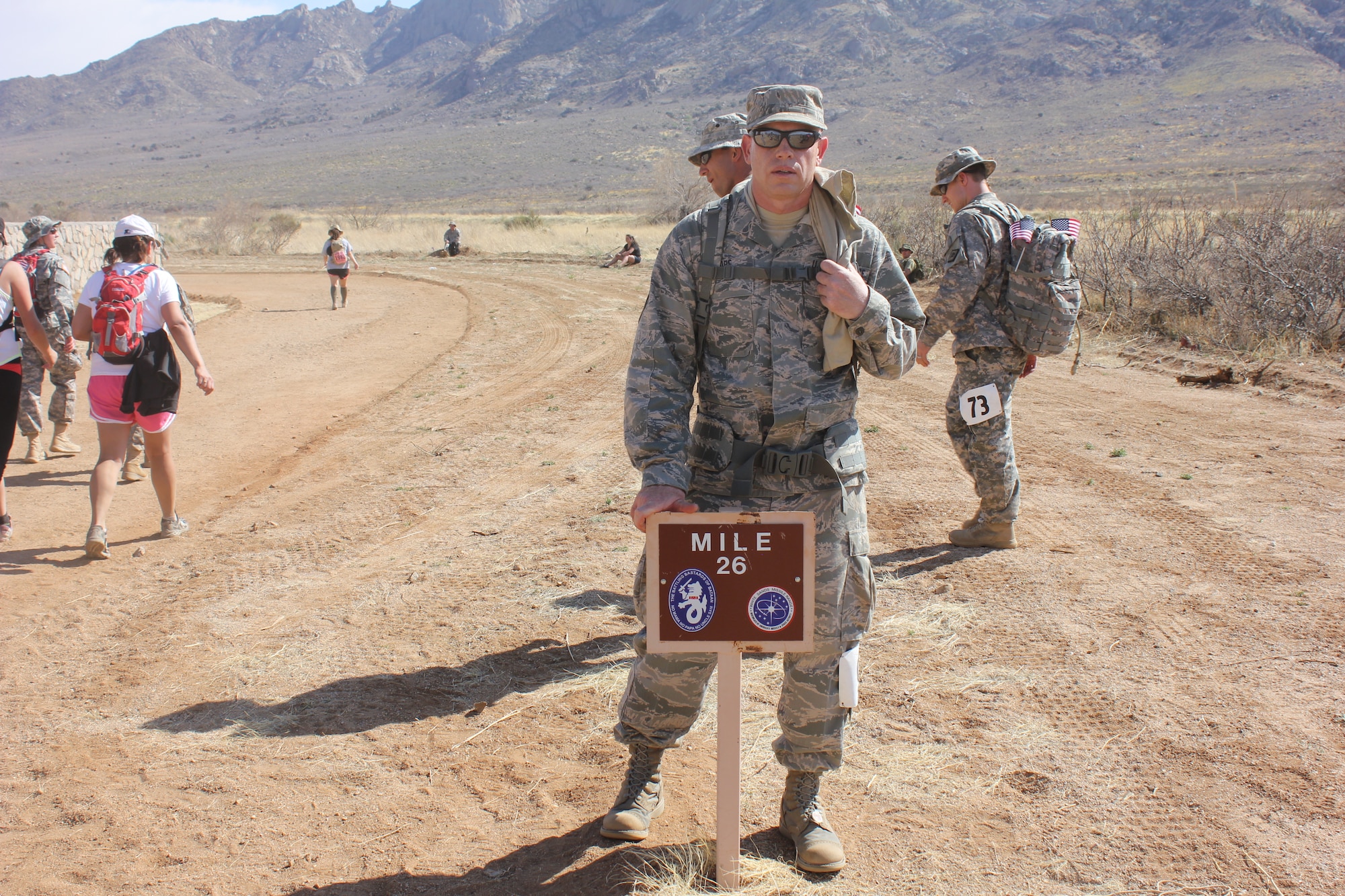 Master Sgt. Michael Moore, Air Reserve Personnel Center training manager, reaches mile 26 during the 23rd Annual Bataan Memorial Death March at White Sands Missile Range near Las Cruces, N.M., March 25, 2012. Moore was among 14 ARPC Airmen who participated in the event. Overall, more than 6,700 men, women and children from the U.S. and from all parts of the world took part in the march. (U.S. Air Force photo/Senior Master Sgt. Eric Dugger)