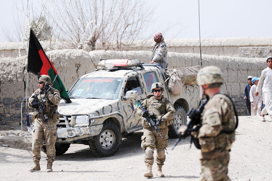 Paratroopers of 1st Platoon, Comanche Company, Task Force Blue Geronimo, work with the Afghan Border Patrol to secure a nearby village during a three-day mission.  (U.S. Army photos/Spc. Erik-James Estrada)
