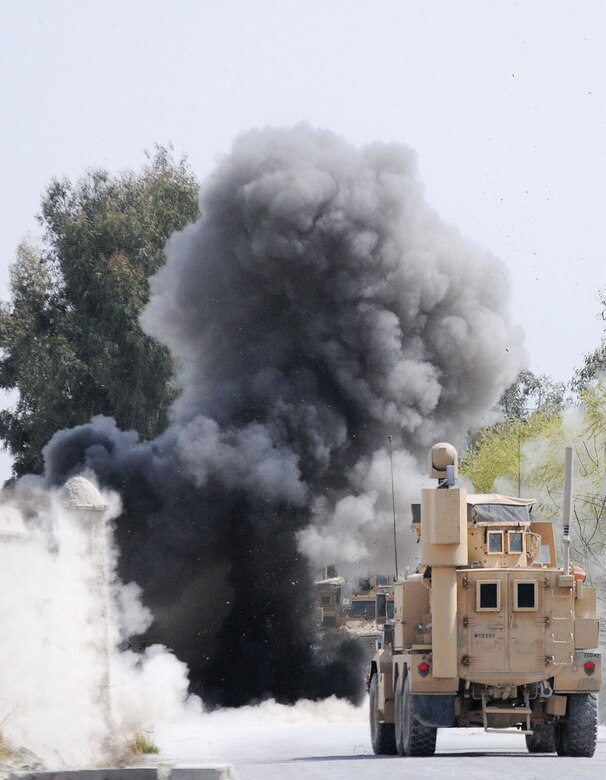 A U.S. Army explosive ordnance disposal unit renders safe an improvised explosive device on the side of Route Crowbar. (U.S. Army photo/Spc. Erik-James Estrada)
