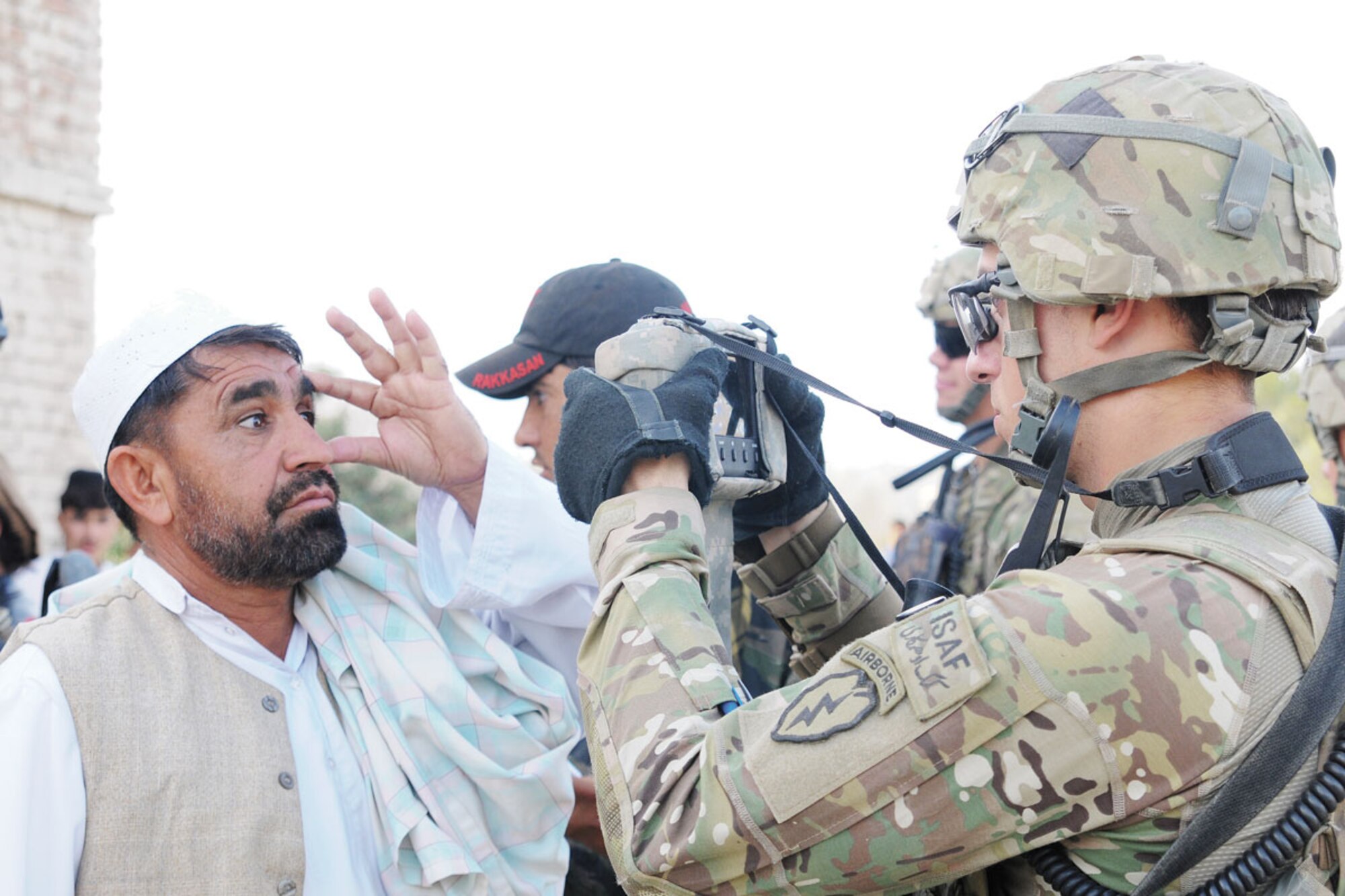 Spc. Michael Santoline with 1st Platoon, Comanche Company, 1st Battalion (Airborne), 501st Infantry Regiment, from Pittsburgh, collects biometric data during a three-day mission. Biometrics collects data using face-recognition, fingerprint and iris identification to populate a database that helps agencies identify insurgents. (U.S. Army photo/Spc. Erik-James Estrada)