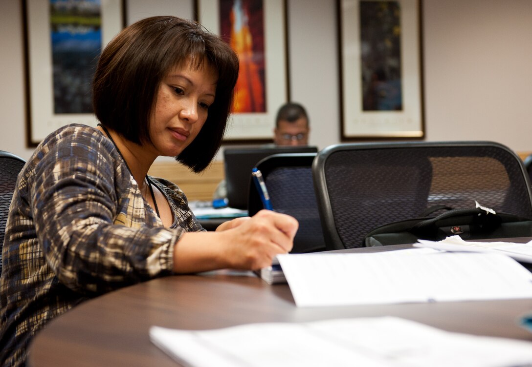 Maj. Evangeline Vida, 28th Medical Operations Squadron aerospace medical flight commander, takes notes during a Transition Assistance Program class in the Airmen and Family Readiness Center on Ellsworth Air Force Base, S.D., March 26, 2012. The program is designed to assist Airmen and their families throughout their transition from military to civilian life. (U.S. Air Force photo by Airman 1st Class Kate Thornton/Released)