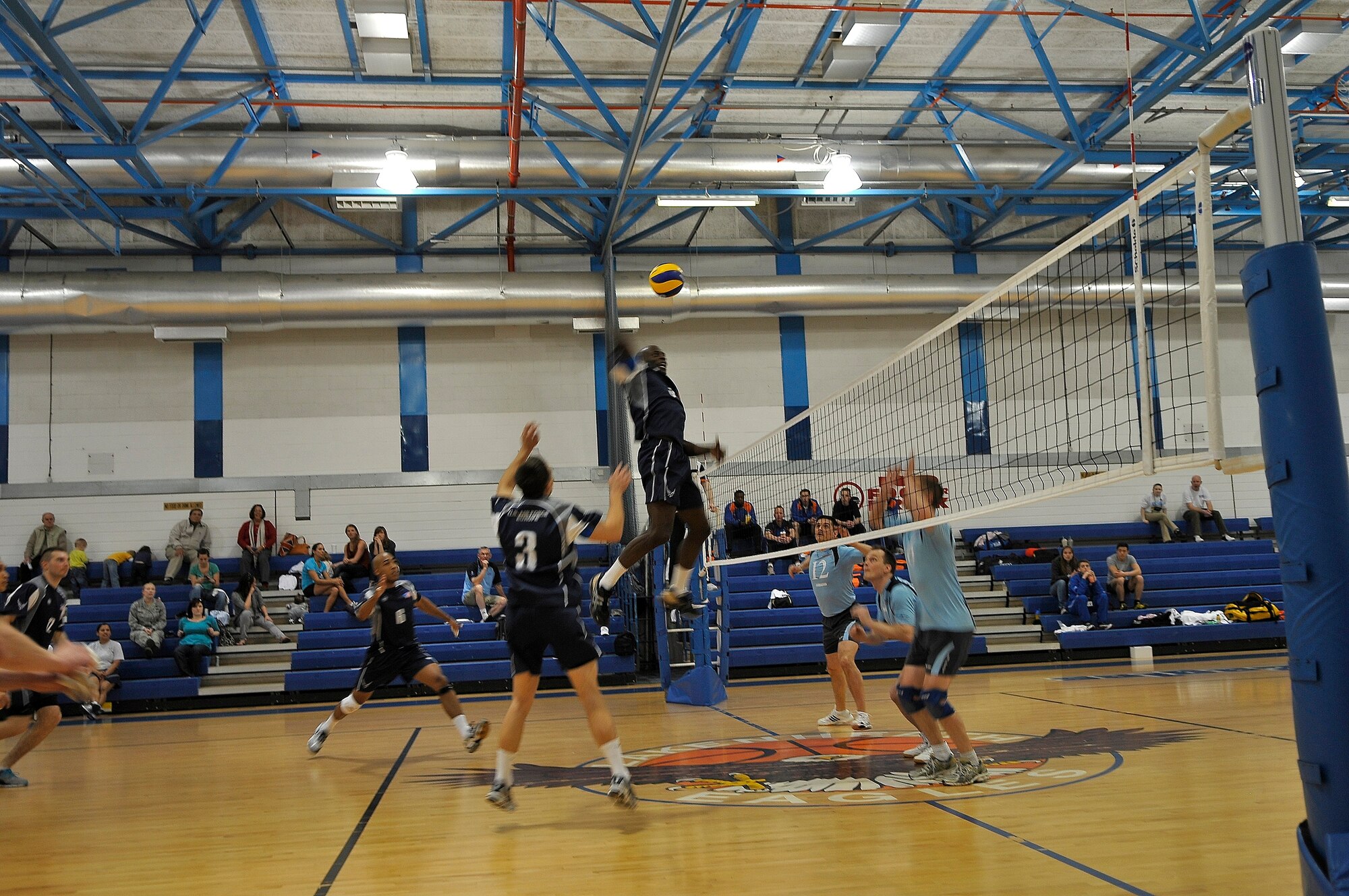 ROYAL AIR FORCE LAKENHEATH, England -- Staff Sgt. Thomas Spencer, Ramstein Air Base Germany, U.S. Air Forces in Europe men's team, spikes the ball against the U.K. Royal Air Force team during the Headquarters Allied Air Component Ramstein Volleyball Championship Tournament at the RAF Lakenheath Fitness Center March 27, 2012.  The aim of the tournament is to encourage and assist the promotion of inter-nation sporting activities among NATO Allied Air Command teams.  The U.S. men?s team won third place in the competition.  (U.S. Air Force photo by Staff Sgt. Connor Estes)