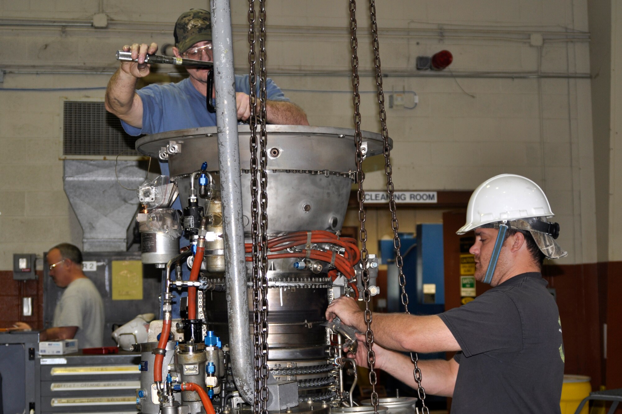 Richard Murchison and Nick Nolte, jet mechanics and Air Reserve Technicians assigned to the 917th Fighter Group, torque a high pressure turbine rotor on a TF34-100A engine at the 917th Propulsion Shop on Barksdale Air Force Base, La., March 15, 2012. Nolte, a staff sergeant, and Murchison, a technical sergeant, are in the Air Force Reserve and is part of a team rebuilding the TF34-100A engine, which is used on A-10 Thunderbolt II jet aircraft. Personnel at the engine shop rebuilt more than 32 engines last year. (U.S. Air Force photo by Master Sgt. Jeff Walston) 