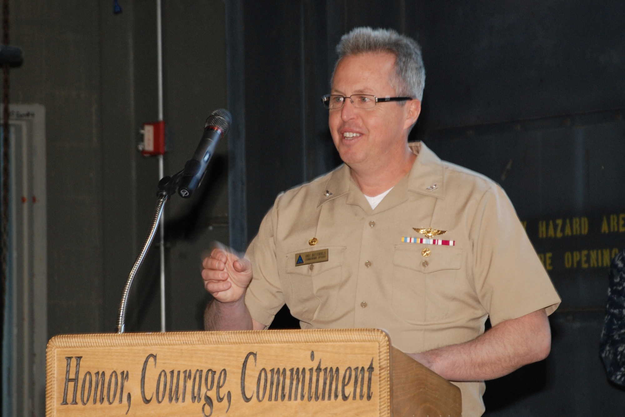 Navy Capt. Andrew Butterfield, Joint Base McGuire-Dix-Lakehurst deputy commander, speaks at the Homecoming Celebration Ceremony March 28 here in honor of the Sailors stationed at Lakehurst who returned from deployment during the past year. Butterfield and Command Master Chief Herbert Kelton, presented all returnees with Certificates of Appreciation for their service and efforts during their overseas deployments. (U.S. Navy photo by Sherry Jacob/Released) 