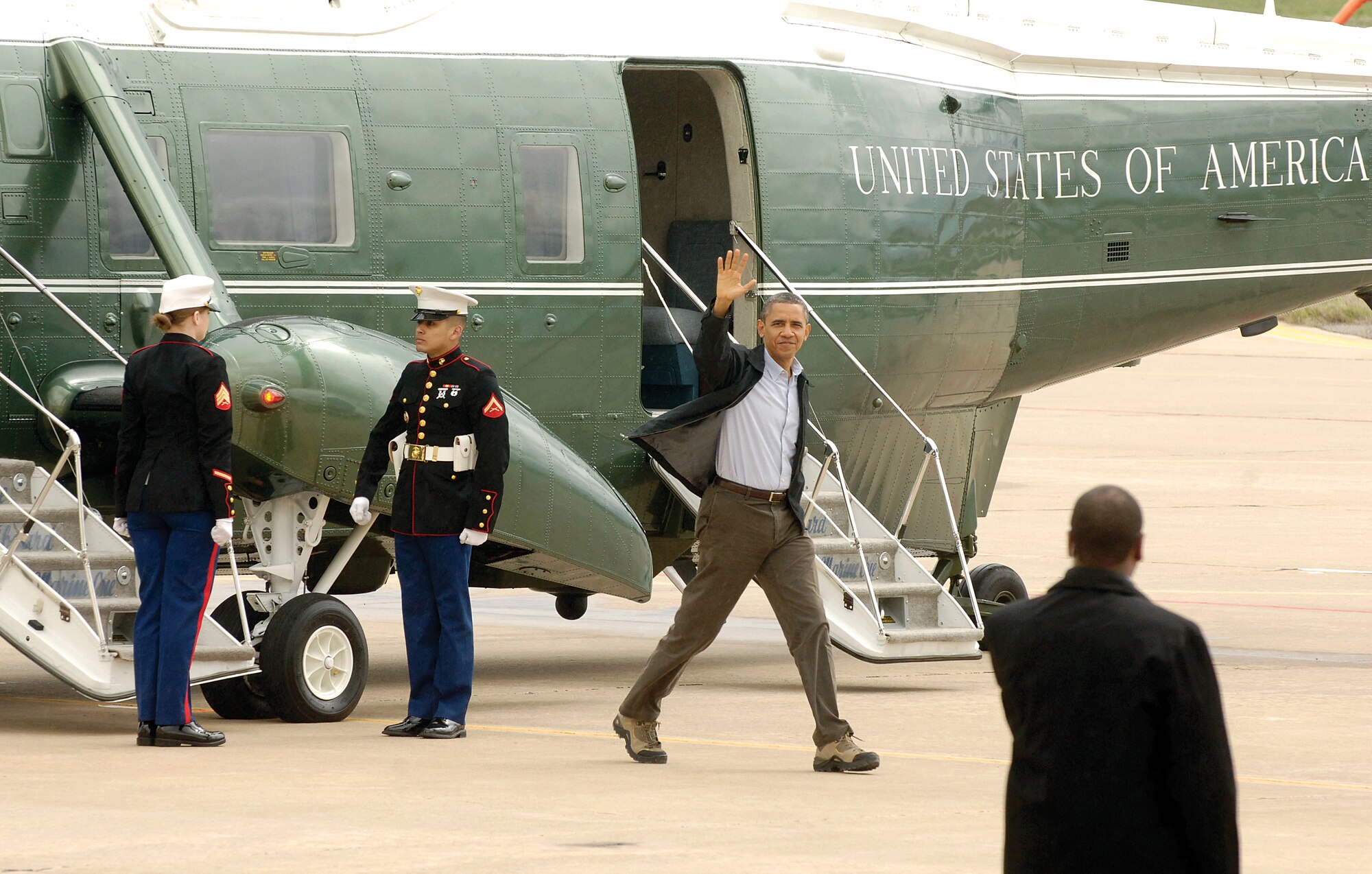 President Barack Obama waves goodbye to Tinker personnel on his way from Marine One to Air Force One March 22. The president stayed the night in Oklahoma City and flew from Tinker to Cushing, Okla., to give a speech on energy. (Air Force photo by Margo Wright)