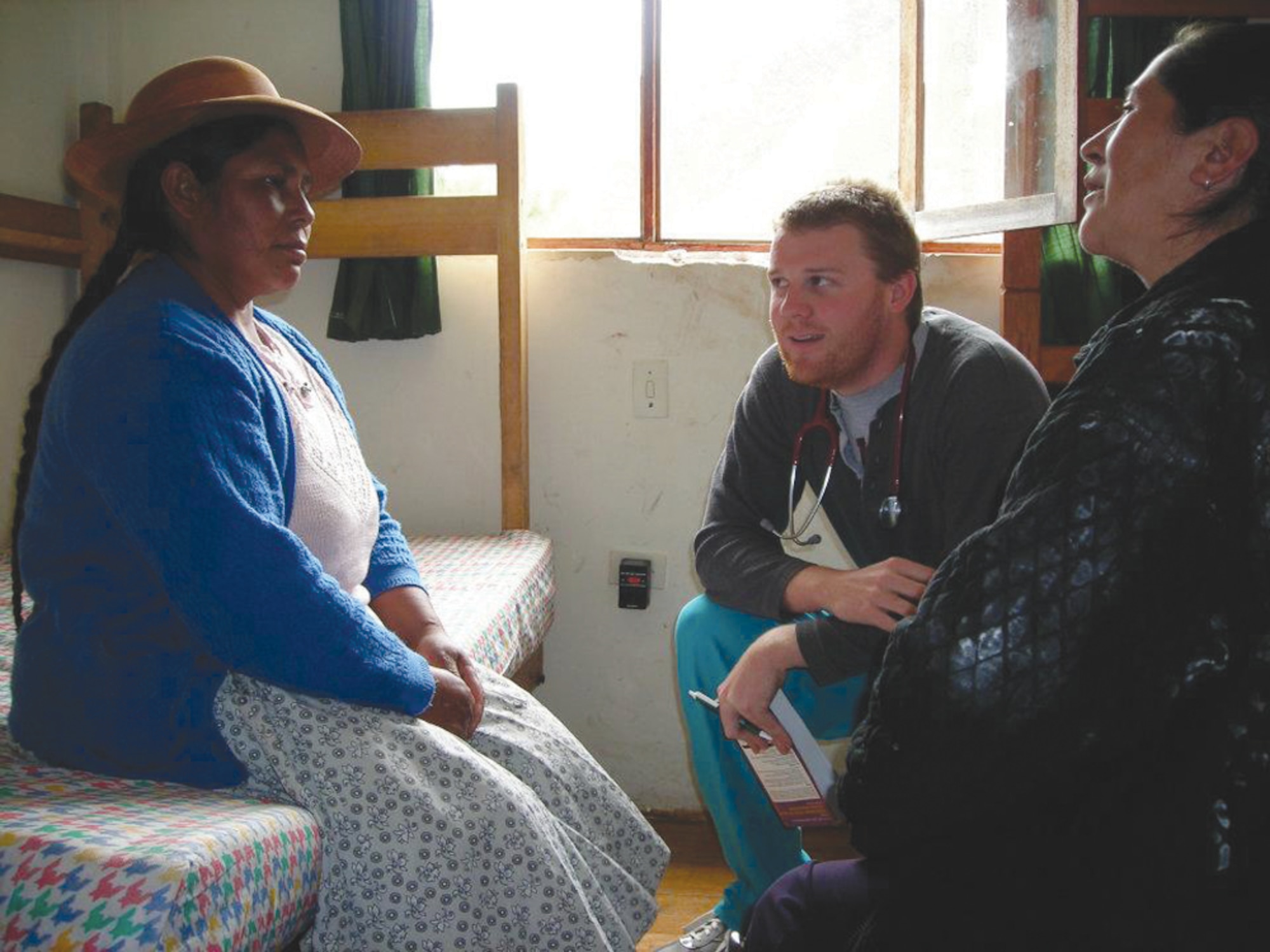 Dr. (Capt.) Nicholas Seeliger, 65th Medical Operations Squadron, speaks with Peruvian patients in the rural highlands of the Andes Mountains in Peru as part of a medical volunteer humanitarian project in 2008. Several members from the 65th Medical Group will participate in Healing Peru April 1 through 15 by providing free medical services to many indigenous people there. (Courtesy photo)