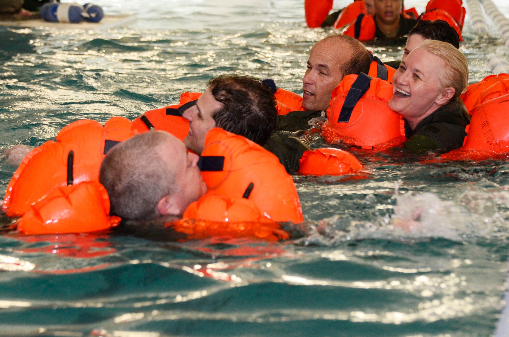 Aircrew members from the 700th Airlift Squadron receive water survival training from 94th Operations Support Squadron Aircrew Flight Equipment Continuation instructors at the Cobb Aquatic Center in Marietta, Ga. Feb. 4. This training is necessary for members to stay proficient on the use of water survival equipment and techniques, and ensures they have the best chance of survival if isolated in a maritime environment. (photo by Don Peek)