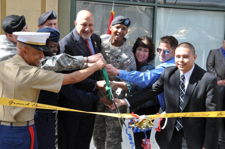 Dignitaries and armed forces representatives cut a ceremonial ribbon during the grand opening of L.A. Career Center March 28 in downtown Los Angeles, Calif. The U.S. Army Corps of Engineers Los Angeles District will manage the lease of the 50,000 square-foot recruitment center for future Soldiers, Airmen and Marines.