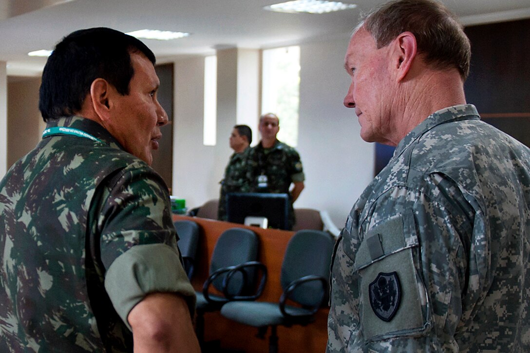 One of Gen. Eduardo Villas Boas' staff members briefs U.S. Army Gen. Martin E. Dempsey, chairman of the Joint Chiefs of Staff, at the jungle training center in Manaus, Brazil, March 28, 2012. Boas is the commander of the Amazon Regional Command. 