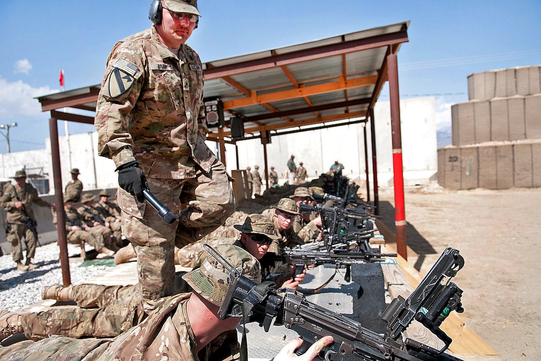 U.S. Army Sgt. 1st Class George Brace helps soldiers sight in their M249 squad automatic weapons on Bagram Air Field, Afghanistan, March 26, 2012. The soldiers must calibrate their light machine guns prior to pushing out to their forward operating bases. Brace is assigned to the 1st Cavalry Division. 
