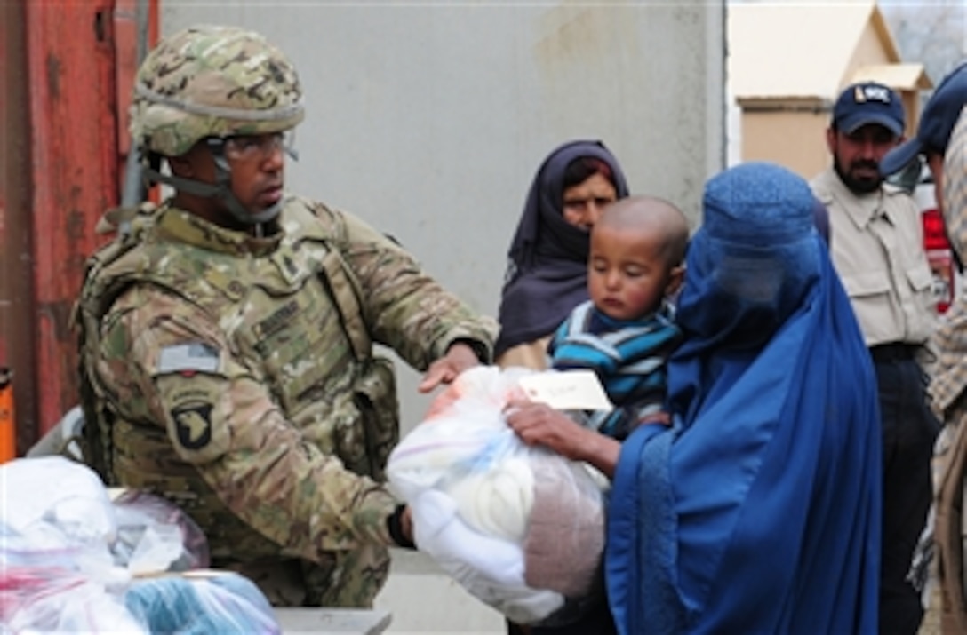 U.S. Army 1st Sgt. Herbert Duvernay with Headquarters and Headquarters Company, 11th Tactical Theater Signal Brigade, Task Force Signal, volunteers with Operation Care at El Salam Egyptian Field Hospital at Bagram Air Field, Afghanistan, on March 27, 2012.  Volunteers helped distribute clothing and various sundry items to Afghan locals.  