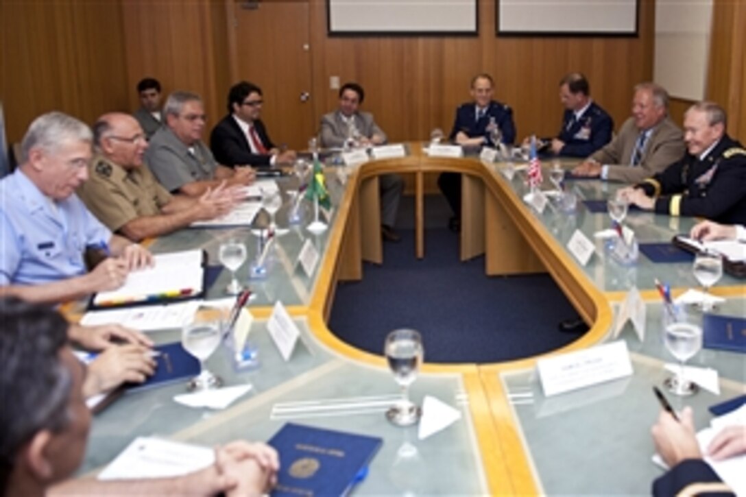 U.S. Army Gen. Martin E. Dempsey, chairman of the Joint Chiefs of Staff, far right center, and Thomas A. Shannon, U.S. Ambassador to Brazil, far right, have a meeting with Army Gen. Jose Carlos de Nardi, Brazilian chief of defense, far left center, and Antonio Celso Amorim, Brazilian defense minister, far left, to discuss their bi-lateral partnership, and Brazil's role in South America as an emerging leader in Brasilia, Brazil, March 29, 2012. 

