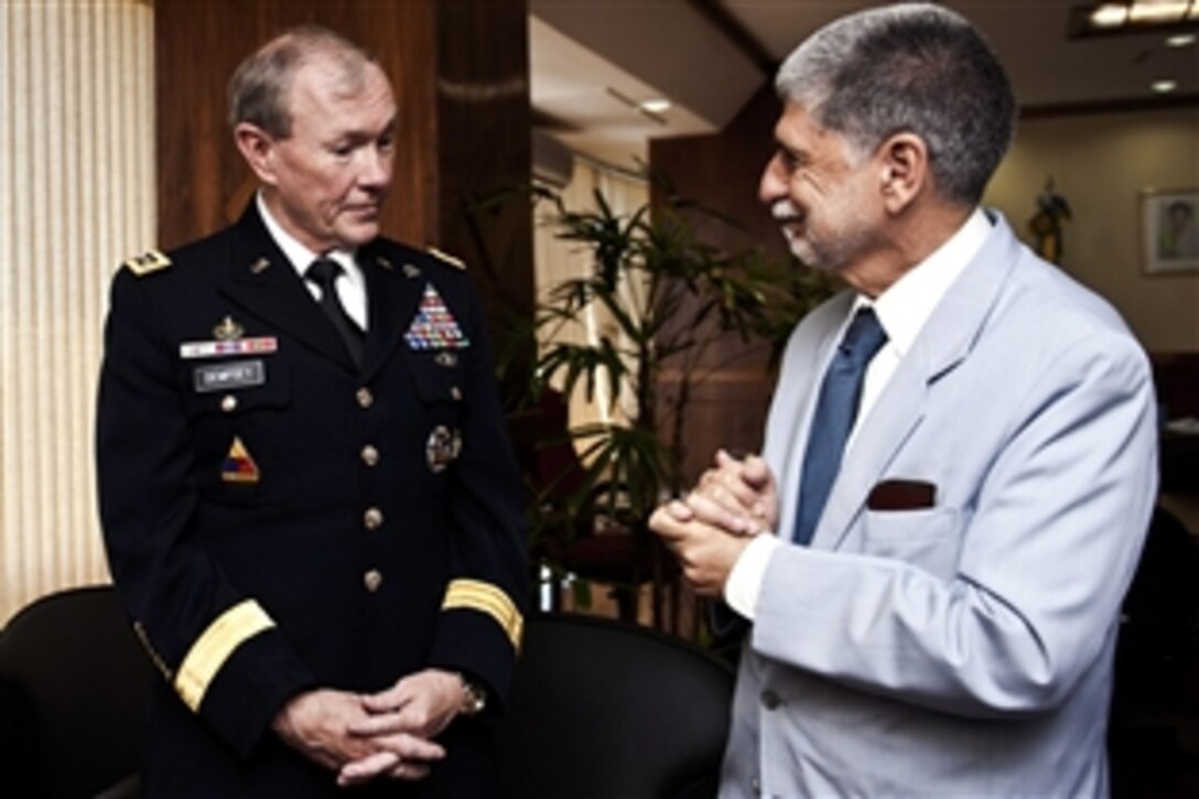 U.S. Army Gen. Martin E. Dempsey, chairman of the Joint Chiefs of Staff, meets with Brazilian Defense Minister Antonio Celso Amorim in Brasilia, Brazil, March 29, 2012. The two leaders discussed Brazil's political, economic and social conditions and its relationship with the United States. 
