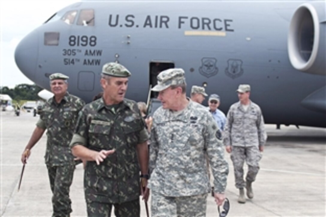 U.S. Army Gen. Martin E. Dempsey, chairman of the Joint Chiefs of Staff, meets with Gen. Eduardo Villas Boas, commander of the Amazon Regional Command, in Manaus, Brazil, March 28, 2012. Dempsey was there to visit one of the many jungle training centers in the Amazon Basin. 
