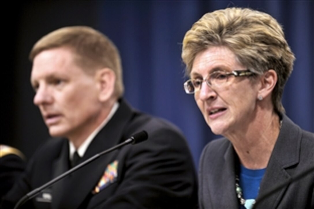 Jo Ann Rooney, acting undersecretary of defense for Personnel and Readiness, right, briefs the media about the release of “Appendix E” documents from the Dover Port Mortary timeline in the Pentagon briefing room, March 30, 2012. The appendix details records of operations at Dover Port Mortuary, Del., from 1990 to 2012. At left, Navy Capt. Craig Mallak, Dover medical examiner.