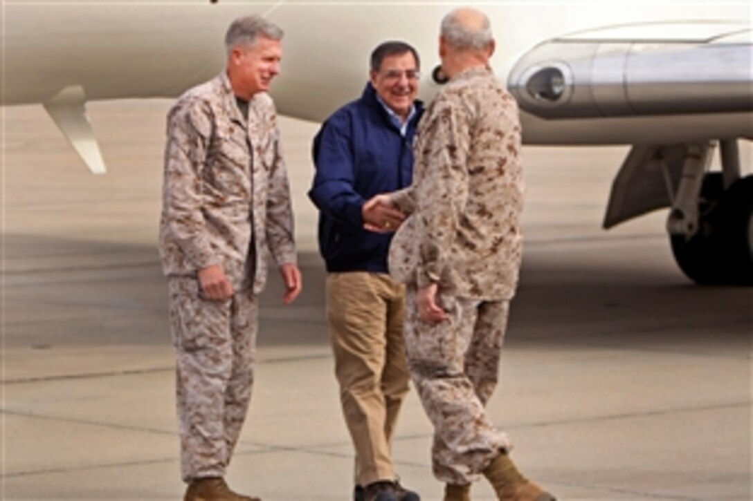 Defense Secretary Leon E. Panetta shakes hands with Marine Corps Lt. Gen. John F. Kelly, the senior military adviser to the defense secretary, during his visit to Marine Corps Air Station Camp Pendleton, Calif., March 30, 2012. Panetta will board a hovercraft to visit the Marines and sailors of the 15th Marine Expeditionary Force aboard the USS Peleliu, which is currently operating off the coast of California.