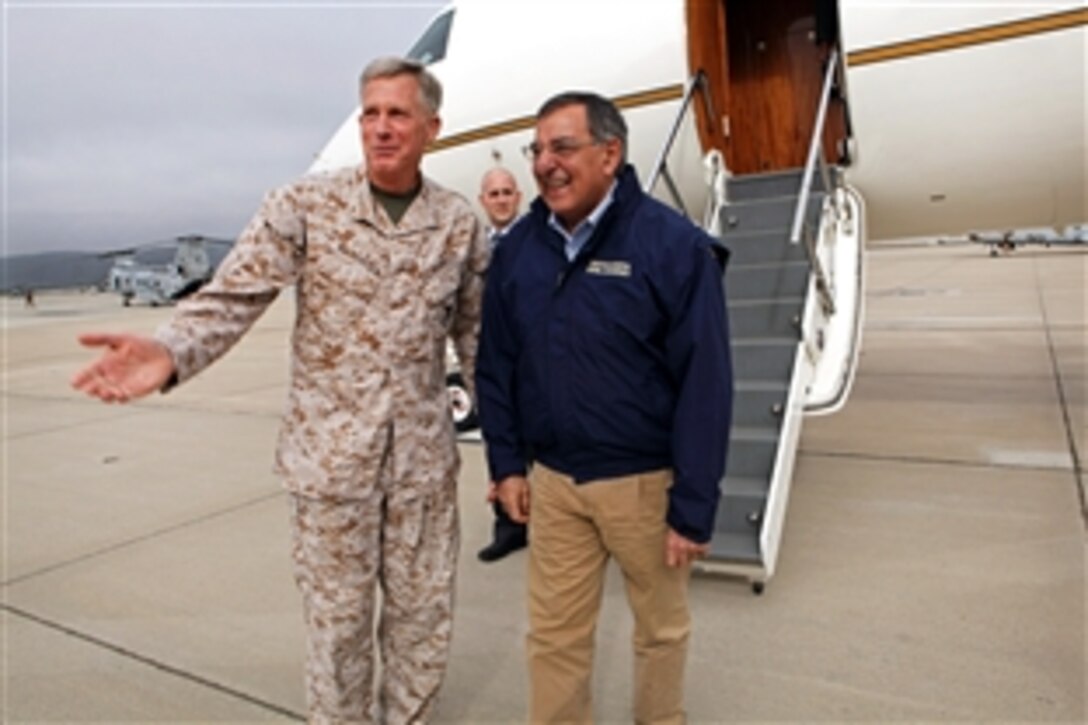 Marine Corps Lt. Gen. Thomas D. Waldhauser, commanding general of the I Marine Expeditionary Force, greets Defense Secretary Leon E. Panetta at the Marine Corps Air Station Camp Pendleton, Calif., March 30, 2012. Panetta will take a hovercraft to board the USS Peleliu as part of his visit. He will speak to the Marines and sailors of the 15th Marine Expeditionary Force and observe flight operations.
