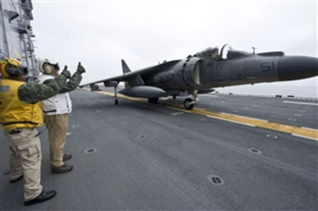 Defense Secretary Leon E. Panetta gives the thumbs up during his launch sequence of an AV-8B Harrier Jet on board the USS Peleliu in the Pacific Ocean, March 30, 2012. Panetta visited Marines and sailors of the 15th Marine Expeditionary Force, who are embarked aboard the ship, which is operating off the coast of California. The secretary visited several areas on board the ship as well as also viewing flight operations on deck. 