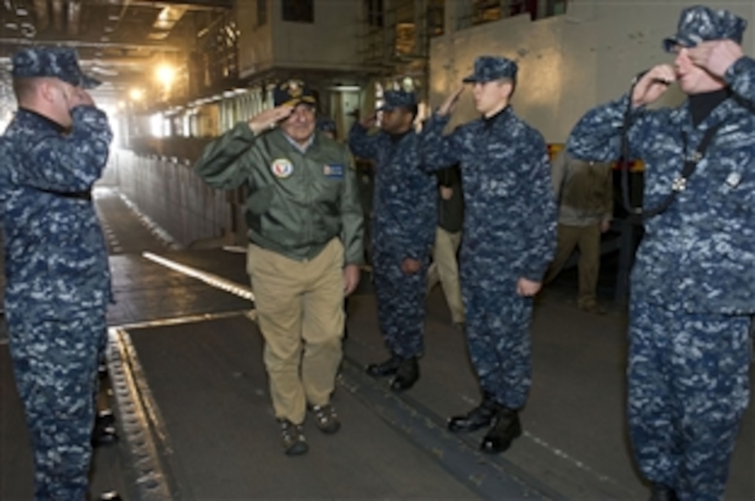 Defense Secretary Leon E. Panetta is piped aboard the USS Peleliu in the Pacific Ocean off the coast of San Diego, March 30, 2012. Panetta visited several areas on board the ship as well as also viewing flight operations on deck.