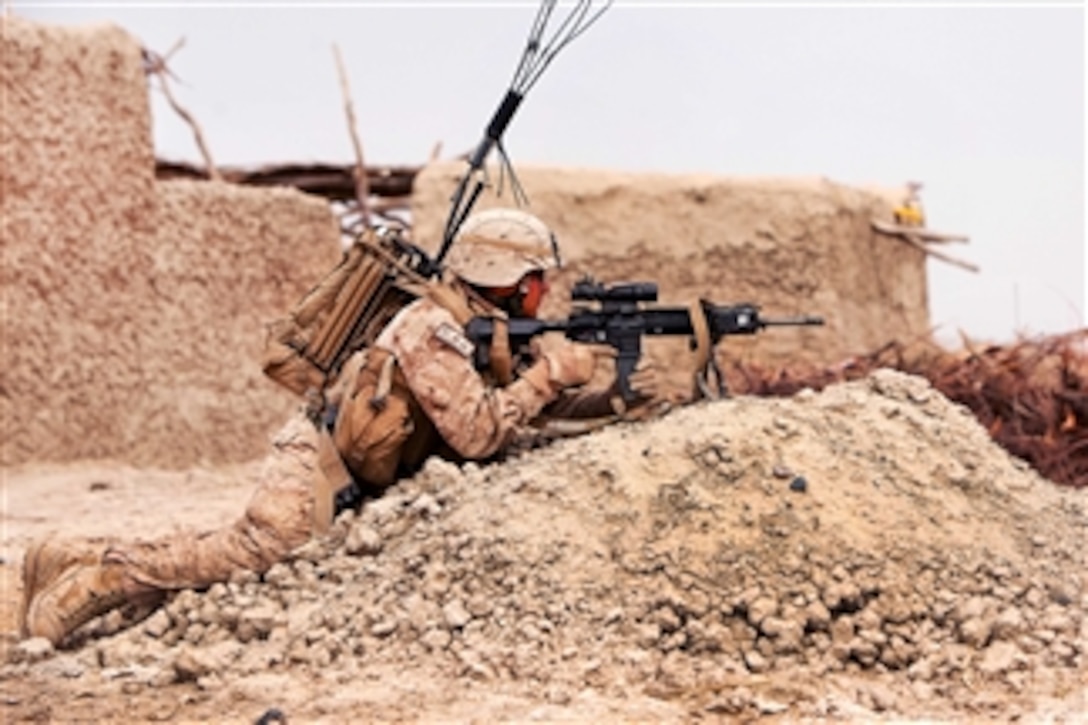 U.S. Marine Corps Lance Cpl. Leobardo Nunez provides security during a census patrol through a village near Khan Neshin, Afghanistan, on March 22, 2012.  Nunez is an infantry automatic rifleman assigned to Alpha Company, 1st Light Armored Reconnaissance Battalion.  