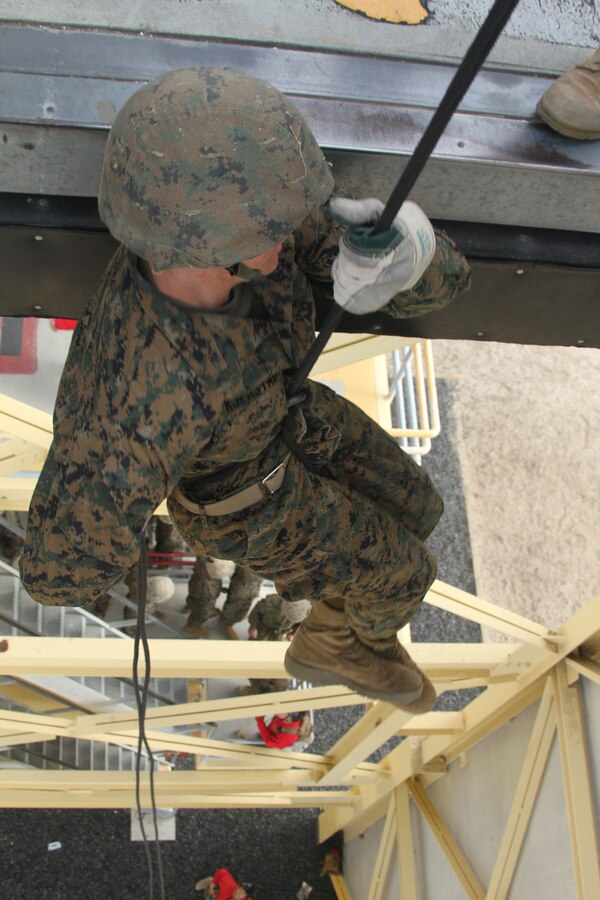 Recruits from Company C race one another down the 60 foot tower aboard Marine Corps Recruit Depot San Diego March 30. Co. C was given classes prior to rappelling and fast roping down the tower so they were properly prepared to take on such a challenge.