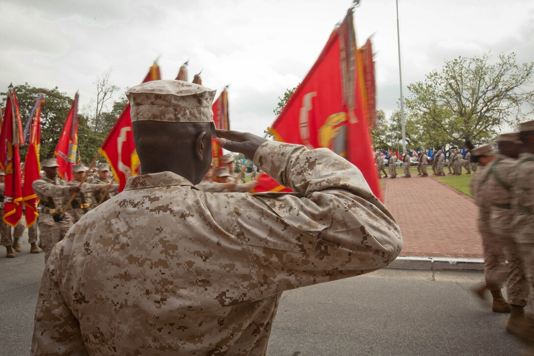 Sergeant Maj. Carl Green, outgoing sergeant major of II Marine Expeditionary Force, salutes the II MEF colors during a relief and appointment ceremony at Marine Corps Base Camp Lejeune, N.C., Mar. 30. Green has served as the sergeant major of II Marine MEF from July 2009 to Mar. 2012. 