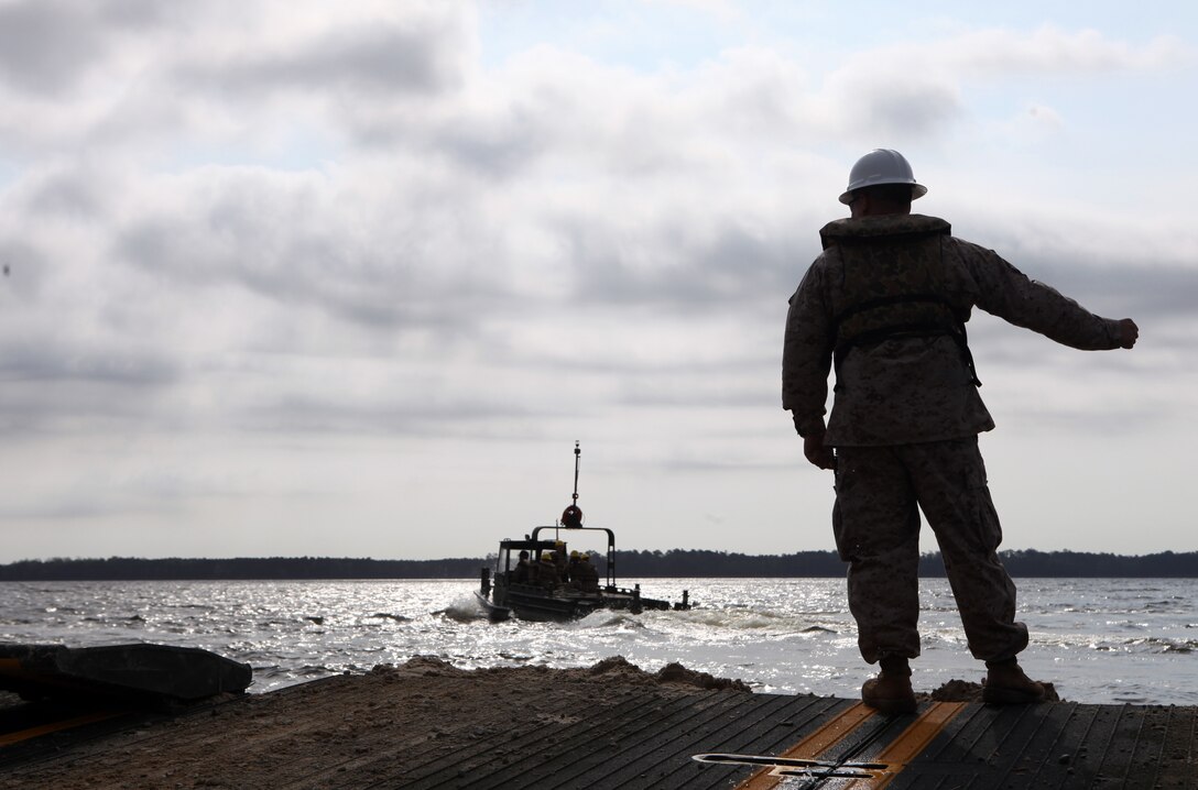 Lance Cpls. Jared Douglas, right, and Ryan McMahon watch the horizon aboard USS Makin Island here March 30. The Marines serves with Battalion Landing Team 3/1, the ground combat element for the 11th Marine Expeditionary Unit. The unit is deployed as part of the Makin Island Amphibious Ready Group, a U.S. Central Command theater reserve force. The group is providing support for maritime security operations and theater security cooperation efforts in the U.S. Navy's 5th Fleet area of responsibility.