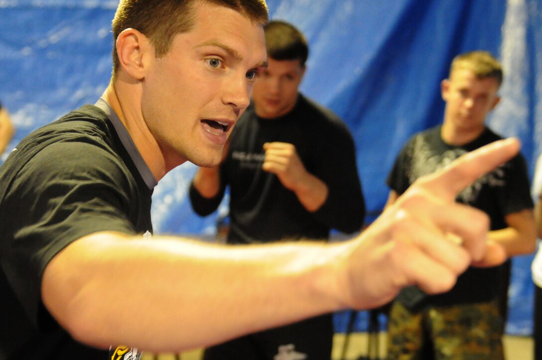 Stephen Thompson, a professional mixed martial artist leads a group of wounded service members in a martial arts drill during an America's Heroes Enjoying Recreation Outdoors (AHERO) turkey hunt in Shorter, Ala. March 31, 2012. Thompson volunteered his time to hunt with the veterans and teach some martial arts techniques. AHERO has taken over 175 wounded veterans on hunting trips since its inception. (U.S. Marine Corps photo by Sgt. Michael V. Walters)