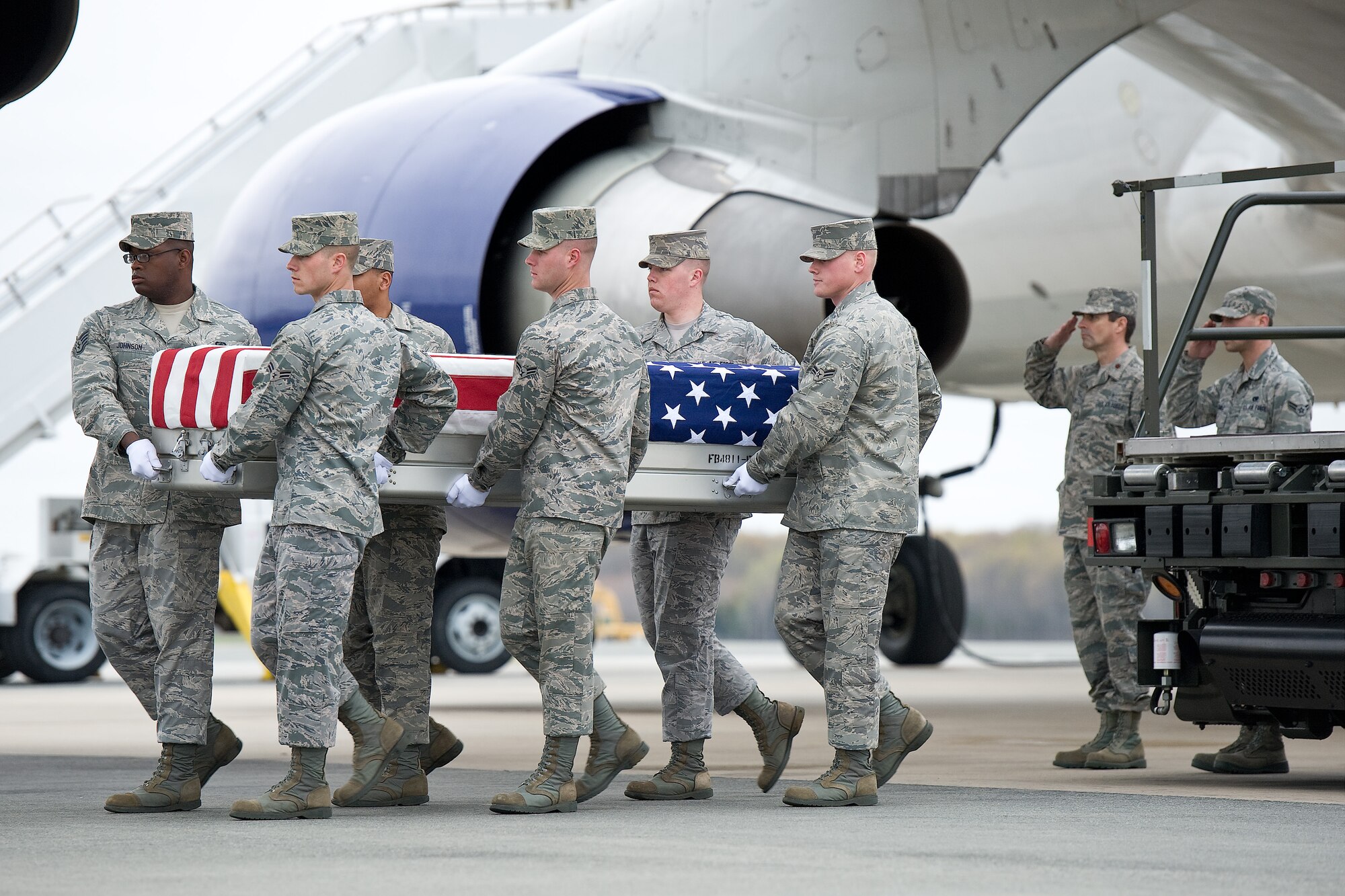 A U.S. Air Force carry team transfers the remains of Air Force Capt. Francis D. Imlay Jr., of Vacaville, Calif., at Dover Air Force Base, Del., March 31, 2012. Imlay was assigned to the 391st Fighter Squadron, Mountain Home Air Force Base, Idaho. (U.S. Air Force photo/Roland Balik)