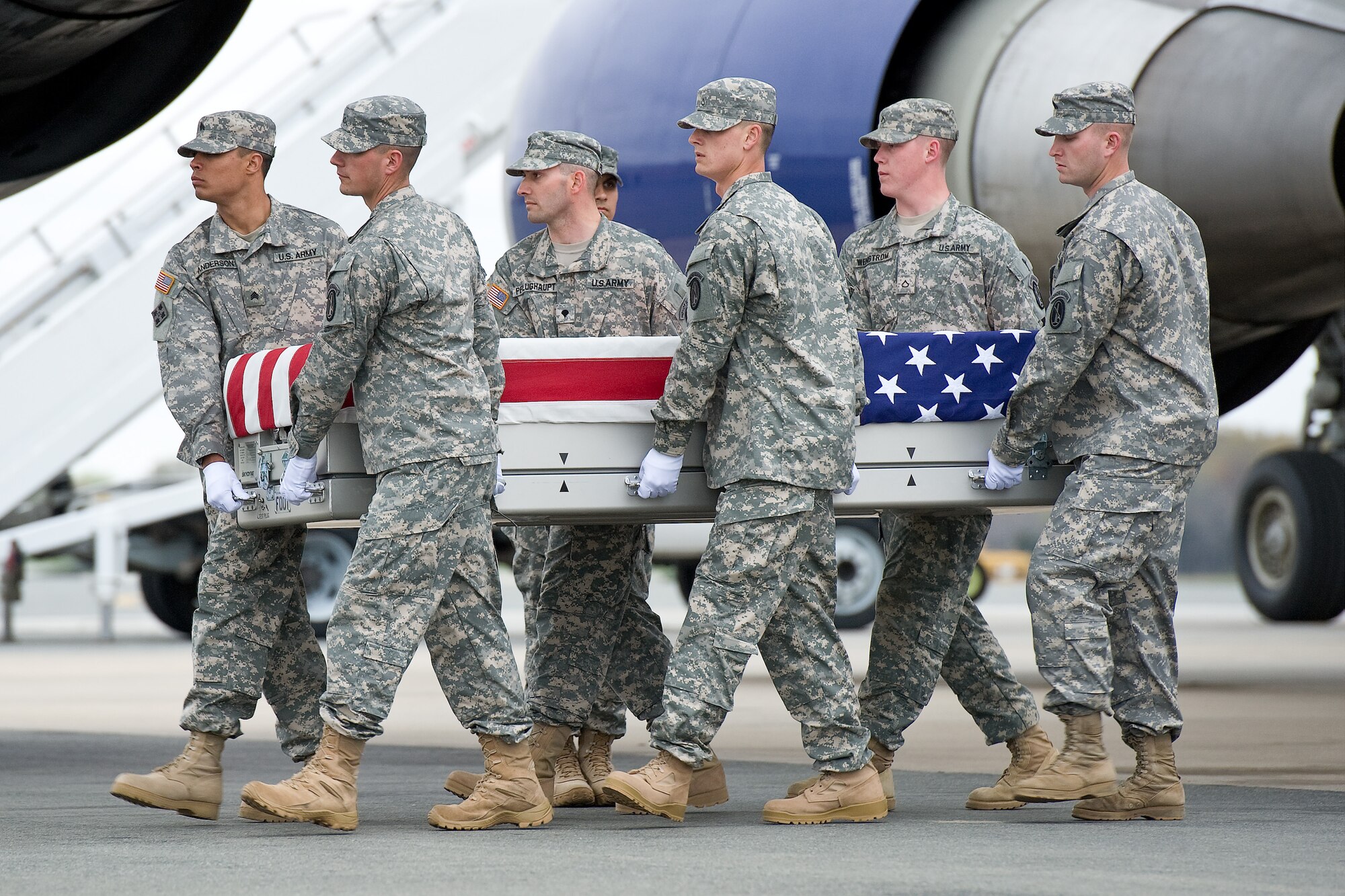A U.S. Army carry team transfers the remains of Army Spc. David W. Taylor, of Dixon, Ky., at Dover Air Force Base, Del., March 31, 2012. Taylor was assigned to the 2nd Battalion, 508th Parachute Infantry Regiment, 4th Brigade Combat Team, 82nd Airborne Division, Fort Bragg, N.C. (U.S. Air Force photo/Roland Balik)
