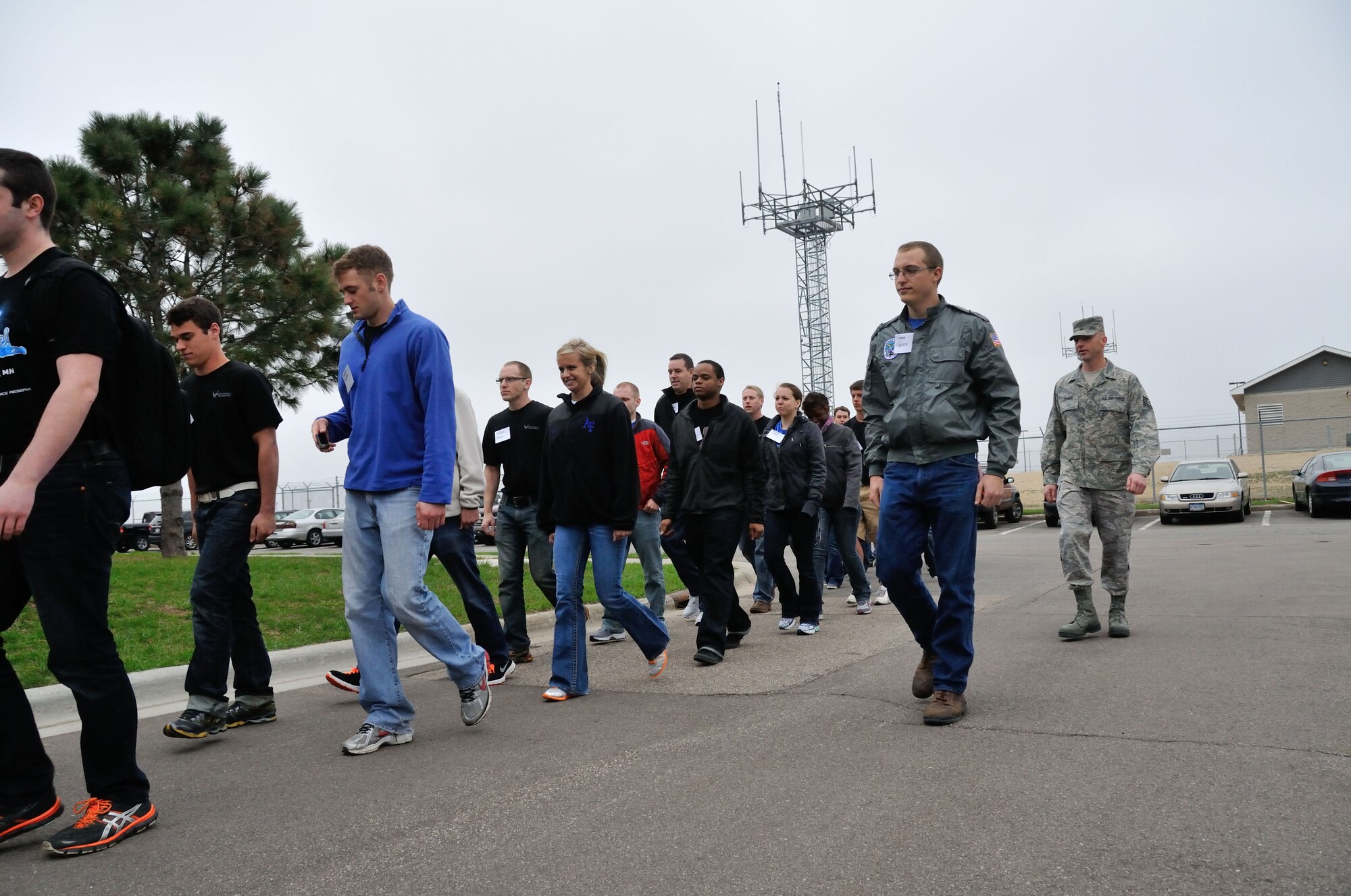 Tech.Sgt. Ricky Zenner instructs Trainee Nelson on the correct way to march a group of the Developmental Training Flight participants, Mar. 31.  The 934th Airlift Wing?s DTF was initiated to familiarize delayed-entry program participants with aspects of military life, including formations, customs and courtesies, and dress and appearance. Minneapolis-St. Paul Air Reserve Station, Minn. (U.S. Air Force photo by Tech Sgt. Bob Sommer)