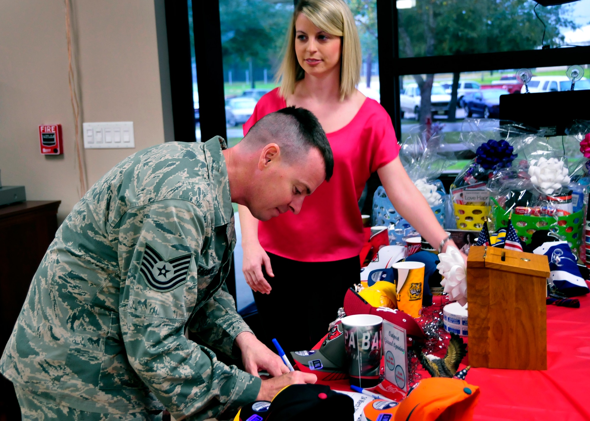 An NCO signs up to win a donated door prize at the grand opening of the newly remodeled Outpost at Duke Field, Fla., recently.   The grand opening featured free food, games, and a live band to showcase the new facility.   The hours of operation are Monday-Friday 11 a.m. to 1 p.m. for lunch, Fridays and UTA Saturdays 3-8 p.m.  (U.S. Air Force photo/Tech. Sgt. Jasmin Taylor)