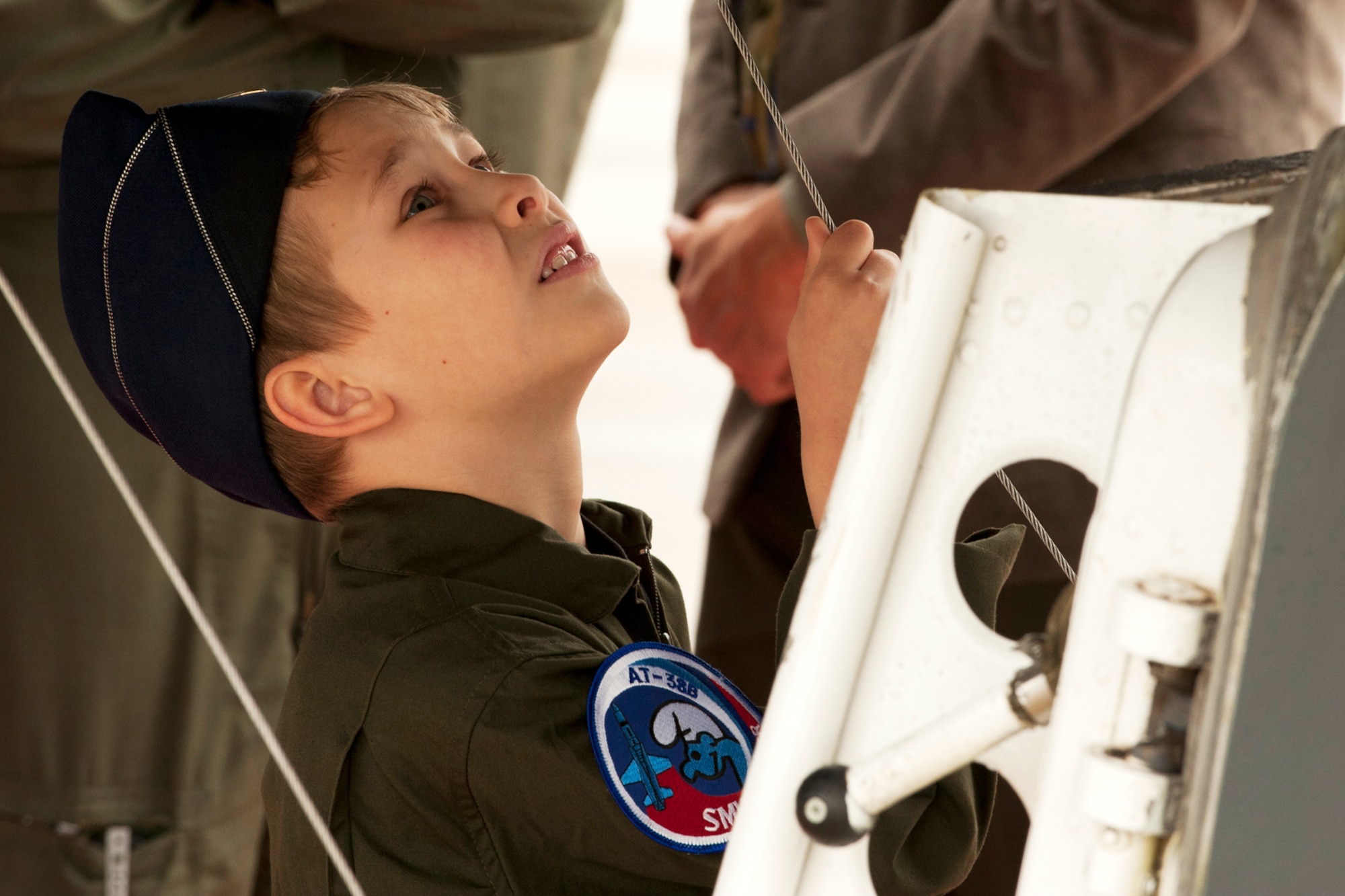 Blake Gilman anxiously waits for his turn to climb up inside the cockpit of a B-52 at Barksdale Air Force Base, La., March 30, 2011. Blake is the son of U.S. Air Force 1st Lt. Craig Gilman, a graduate of the Formal Training Unit Class 11-03. (U.S. Air Force photo by Master Sgt. Greg Steele/Released)