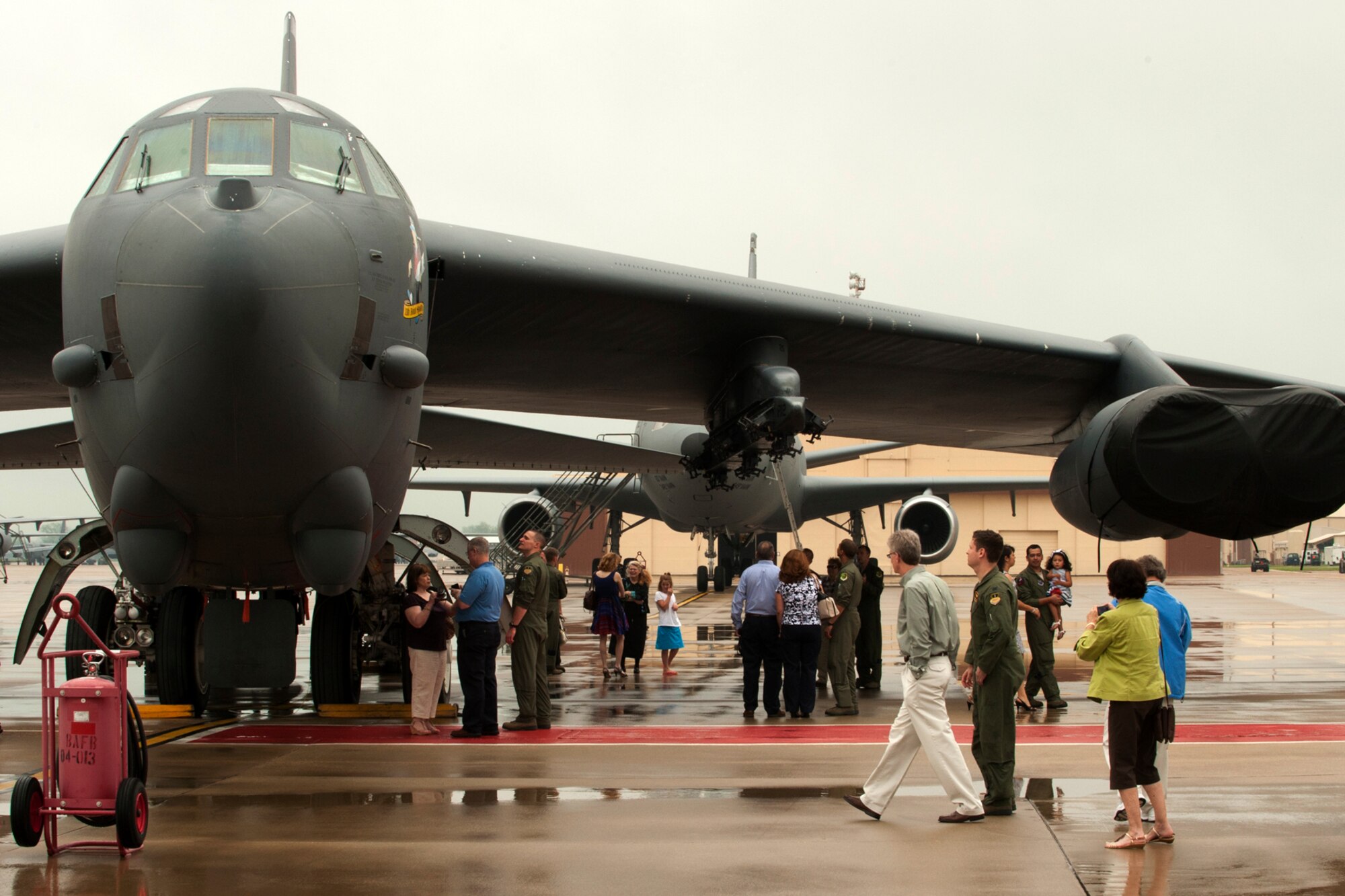 Students from the Formal Training Unit Class 11-03, show friends and family a 93rd Bomb Squadron B-52H Stratofortress following a graduation ceremony on Barksdale Air Force Base, La., March 30, 2012. Class 11-03, made up of Pilots, Copilots and Navigators, finished the 9-month course and will be assigned to B-52 squadrons at Barksdale and Minot AFB. (U.S. Air Force photo by Master Sgt. Greg Steele/Released)