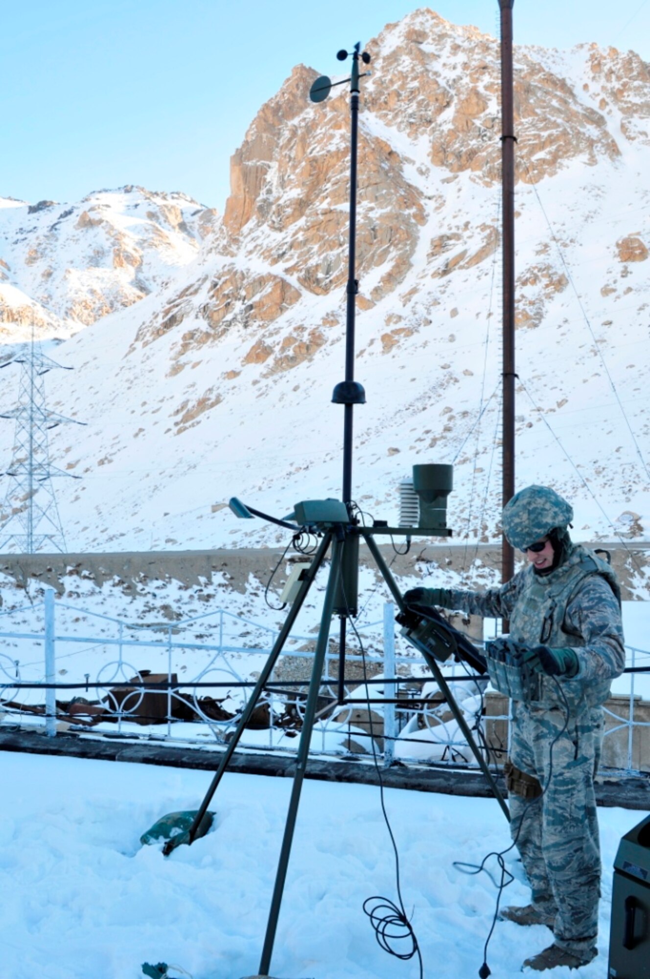 Senior Airman Erik Dowling reads the observation data from a tactical meteorological observing system at Bagram Airfield, Afghanistan.  Dowling is a battlefield weather Airman with the 19th Expeditionary Weather Squadron.  (U.S. Army courtesy photo)