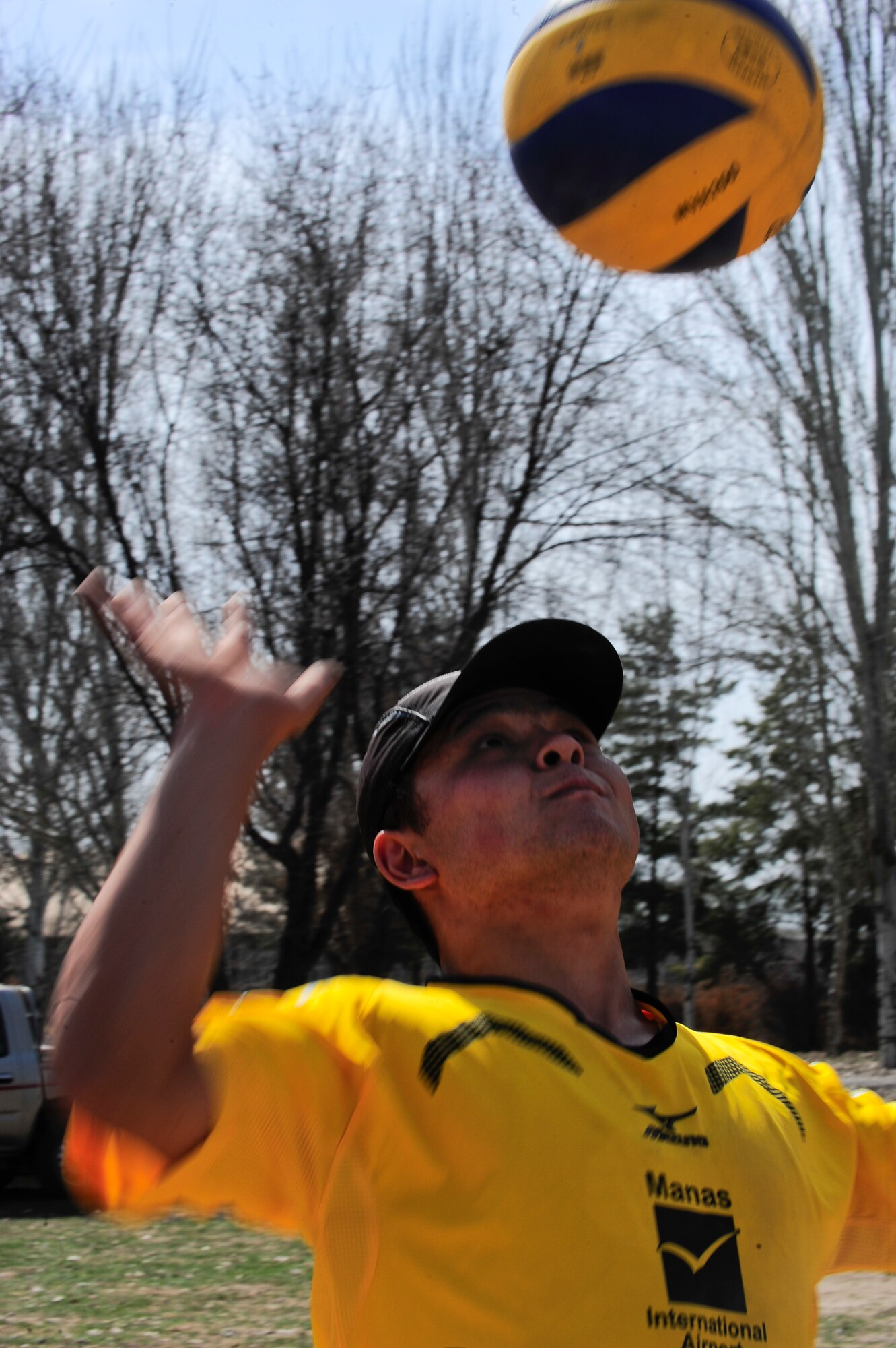 Yzov Ermat serves the ball March 30, 2012, during a sports day challenge to celebrate "Persian New Year" in Manas, Kyrgyzstan. Ermat is an electrician for Manas International Airport. He participated in the soccer and volleyball challenges. (U.S. Air Force photo/Staff Sgt. Angela Ruiz)