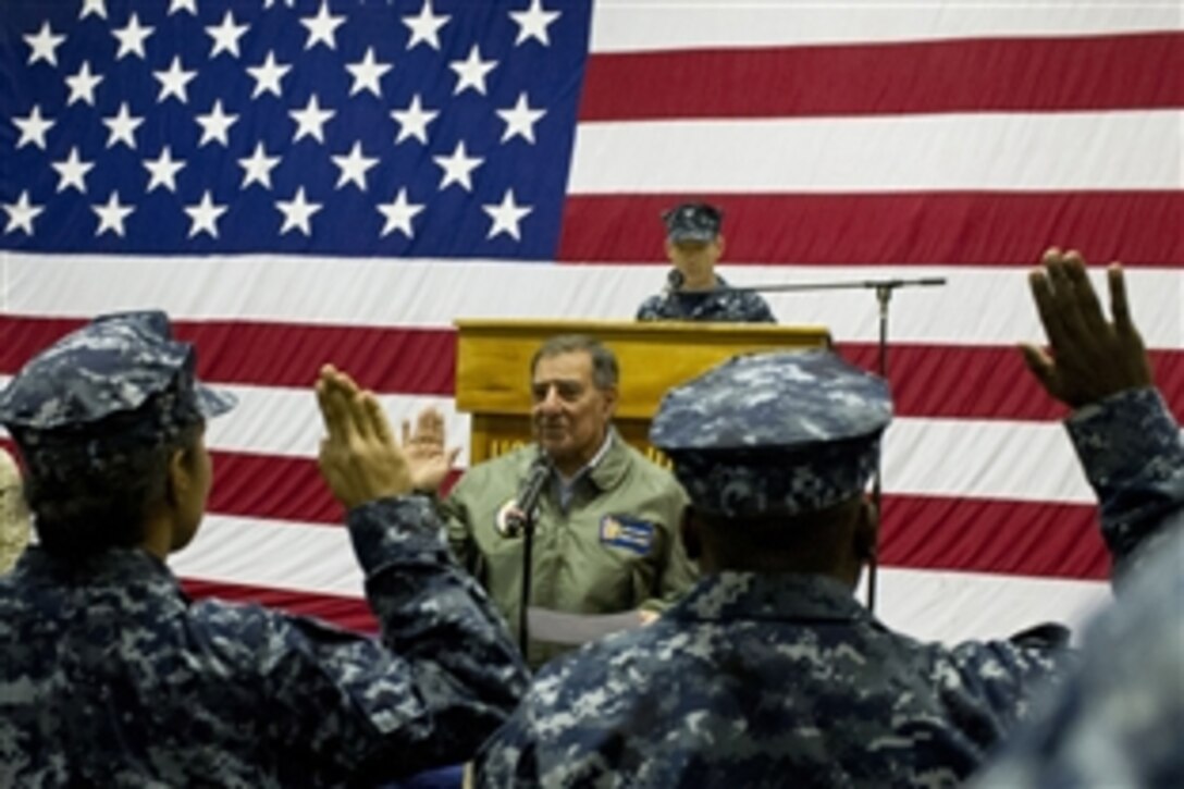 Defense Secretary Leon E. Panetta re-enlists sailors and Marines on board the USS Peleliu in the Pacific Ocean, March 30, 2012. Panetta visited Marines and sailors of the 15th Marine Expeditionary Force, who are embarked aboard the ship, which is operating off the coast of California.