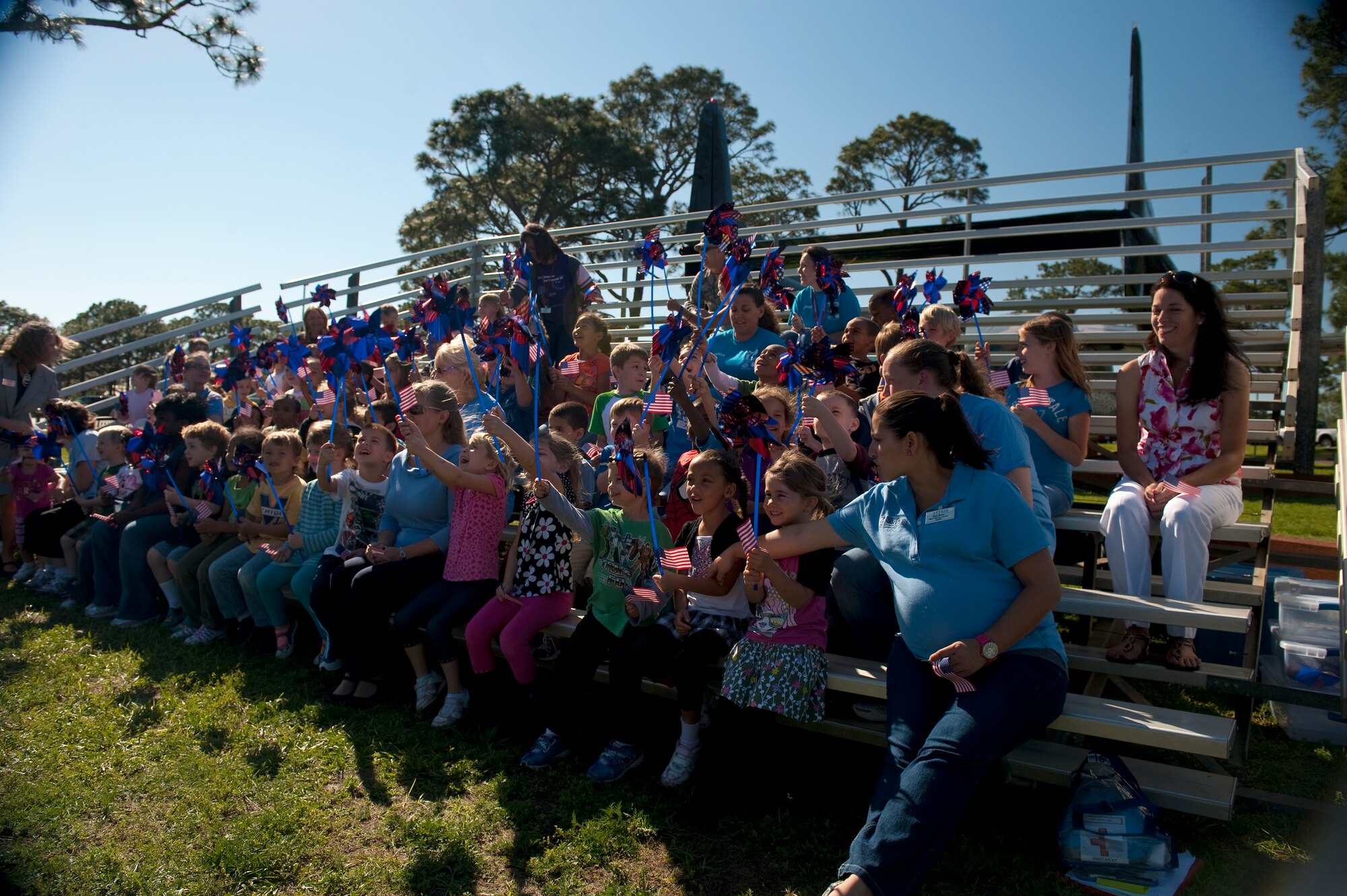 Children from the base Child Development Center play with pinwheels during a proclamation-signing ceremony at the Airpark on Hurlburt Field, Fla. April 24, 2012.  According to the Department of Defense’s website, April is designated as the Month of the Military Child to celebrate the unique contributions, commitment and sacrifices children make on behalf of our country. (U.S. Air Force photo by Airman 1st Class Christopher Williams) (RELEASED)