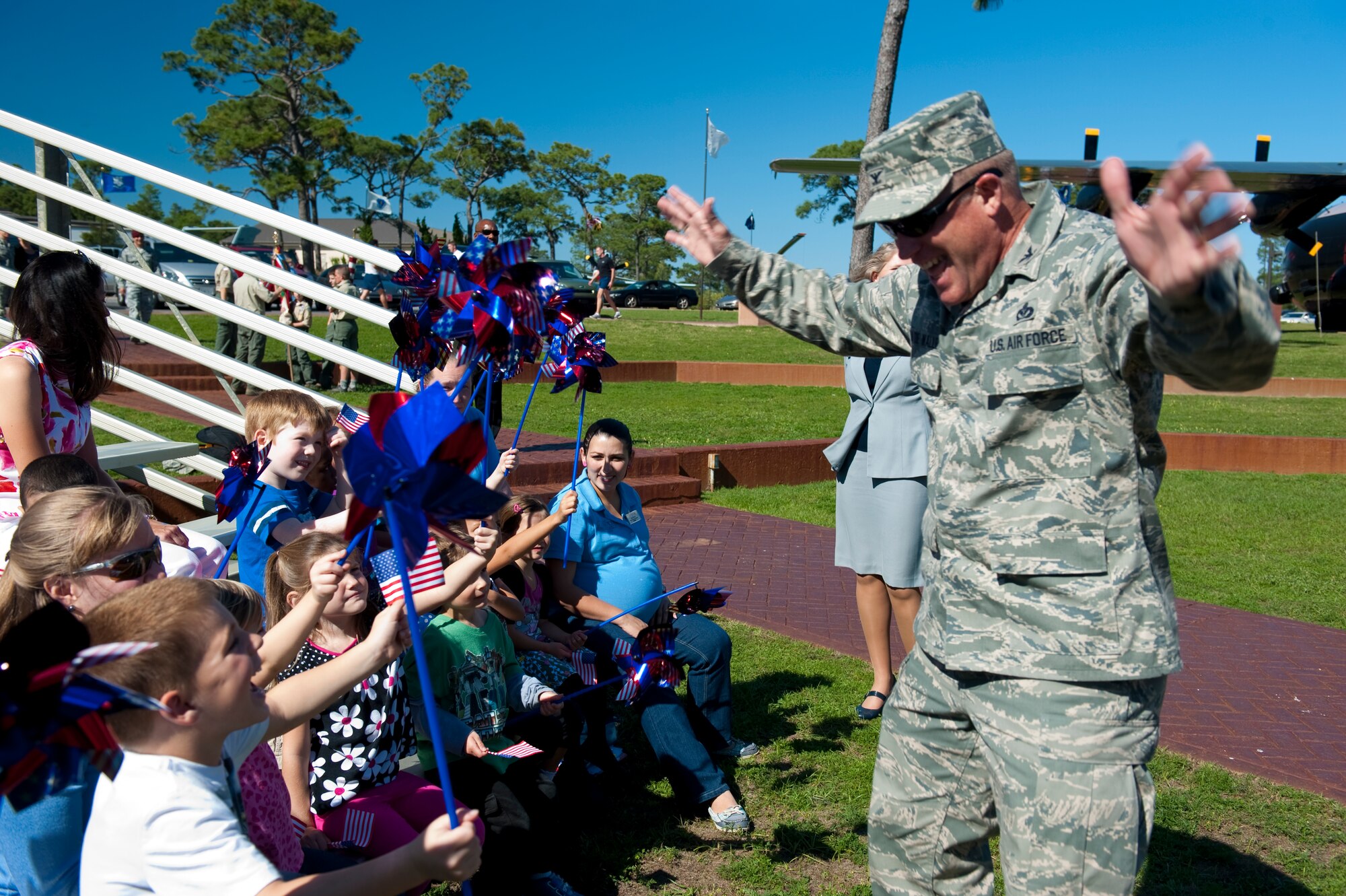 Col. Curt Van De Walle, commander of 1st Special Operations Mission Support Group, plays with children from the Child Development Center during during a proclamation-signing ceremony at the Airpark on Hurlburt Field, Fla. April 24, 2012. The base community also held several children-related activities throughout the month including a military dress-up day at the child development center, parent/guardian photo day and a family movie night at the community park.   (U.S. Air Force photo by Airman 1st Class Christopher Williams) (RELEASED)