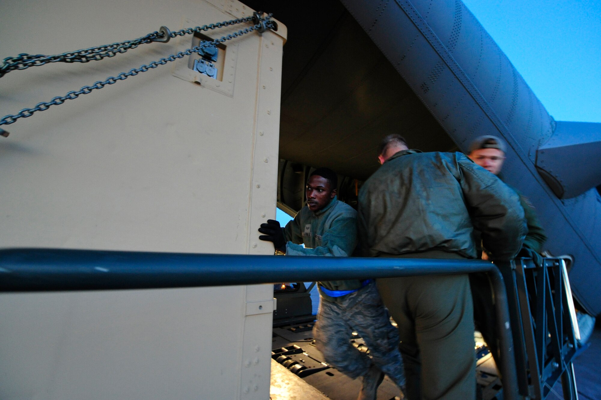 SYDNEY, Nova Scotia -- Senior Airman Casey Jones, an air transportation journeyman assigned to the 621st Contingency Response Wing at Joint Base McGuire-Dix-Lakehurst, N.J., pushes a cargo container from a C-130 Hercules onto a next generation small loader here, April 26.  Jones was part of a three-man team of aerial porters responsible for offloading specialized dive equipment belonging to Explosive Ordinance Disposal Mobile Unit 12, based at Little Creek, Va., prior to their participation in Exercise Ardent Sentry 2012, a major NORAD and U.S Northern Command exercise focused on defense support to civil authorities. (U.S. Air Force photo by Tech. Sgt. Parker Gyokeres) (Released)