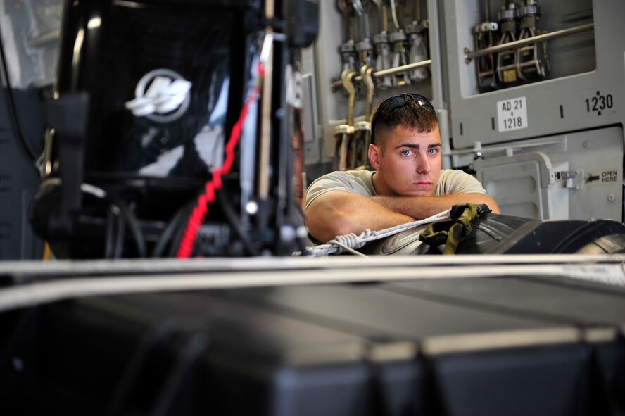 SYDNEY, Nova Scotia -- Staff Sgt. Dustin Pavleski, an air transportation journeyman assigned to the 621st Contingency Response Wing at Joint Base McGuire-Dix-Lakehurst, N.J., waits to offload U.S. Navy equipment from a JB MDL-based C-17 Globemaster III here, April 26, 2012. Pavelski’s three-man team of aerial porters was responsible for offloading specialized diving equipment belonging to Explosive Ordinance Disposal Mobile Unit 12, based at Little Creek, Va., prior to their participation in Exercise Ardent Sentry 2012, a major NORAD and U.S Northern Command exercise focused on defense support to civil authorities. (U.S. Air Force photo/Tech. Sgt. Parker Gyokeres)