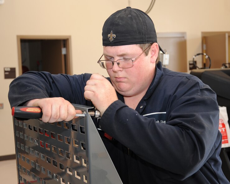 Blake Pittenger, 2nd Force Support Squadron Auto Craft Shop assistant, makes a bracket on Barksdale Air Force Base, La. May 1. The Auto Craft Shop will have its grand opening May 22. The shop offers a variety of services, such as front end alignments, a car wash station, Do-It-Yourself tools for check out, and fully certified mechanics. (U.S. Air Force photo/Senior Airman Sean Martin)(RELEASED)
